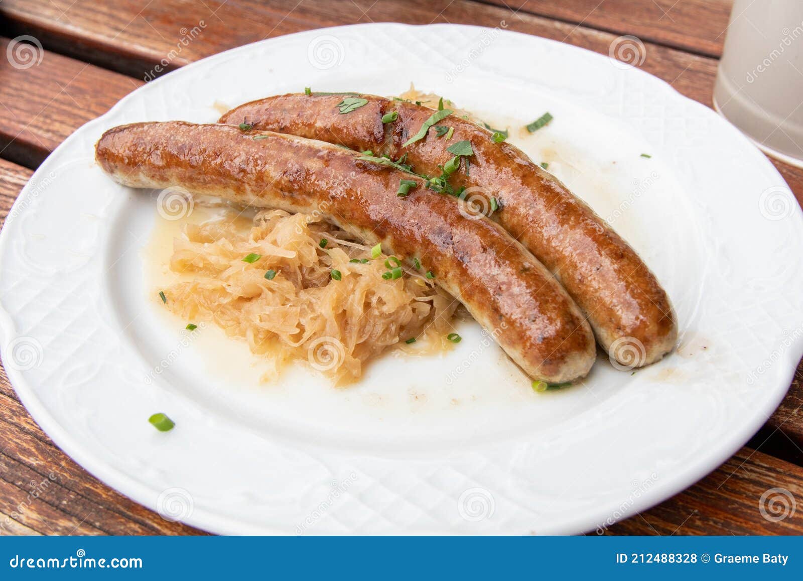 Bratwurst Sausage BrÃ¤twurst, BrÃ¤t, Wurstand Sauerkraut Traditional German  Dish/food with Garnish/chives on a White Plate and Stock Photo - Image of  fried, closeup: 212488328