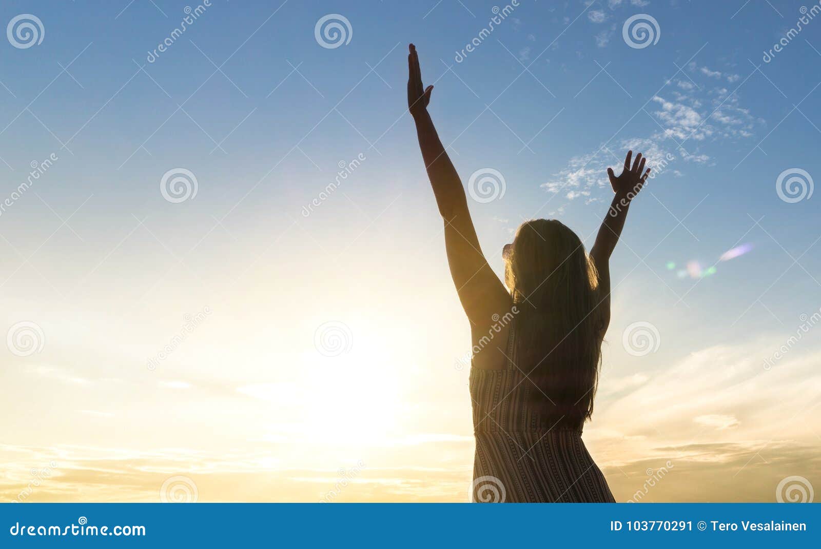 brave happy young woman raising hands up in the air.