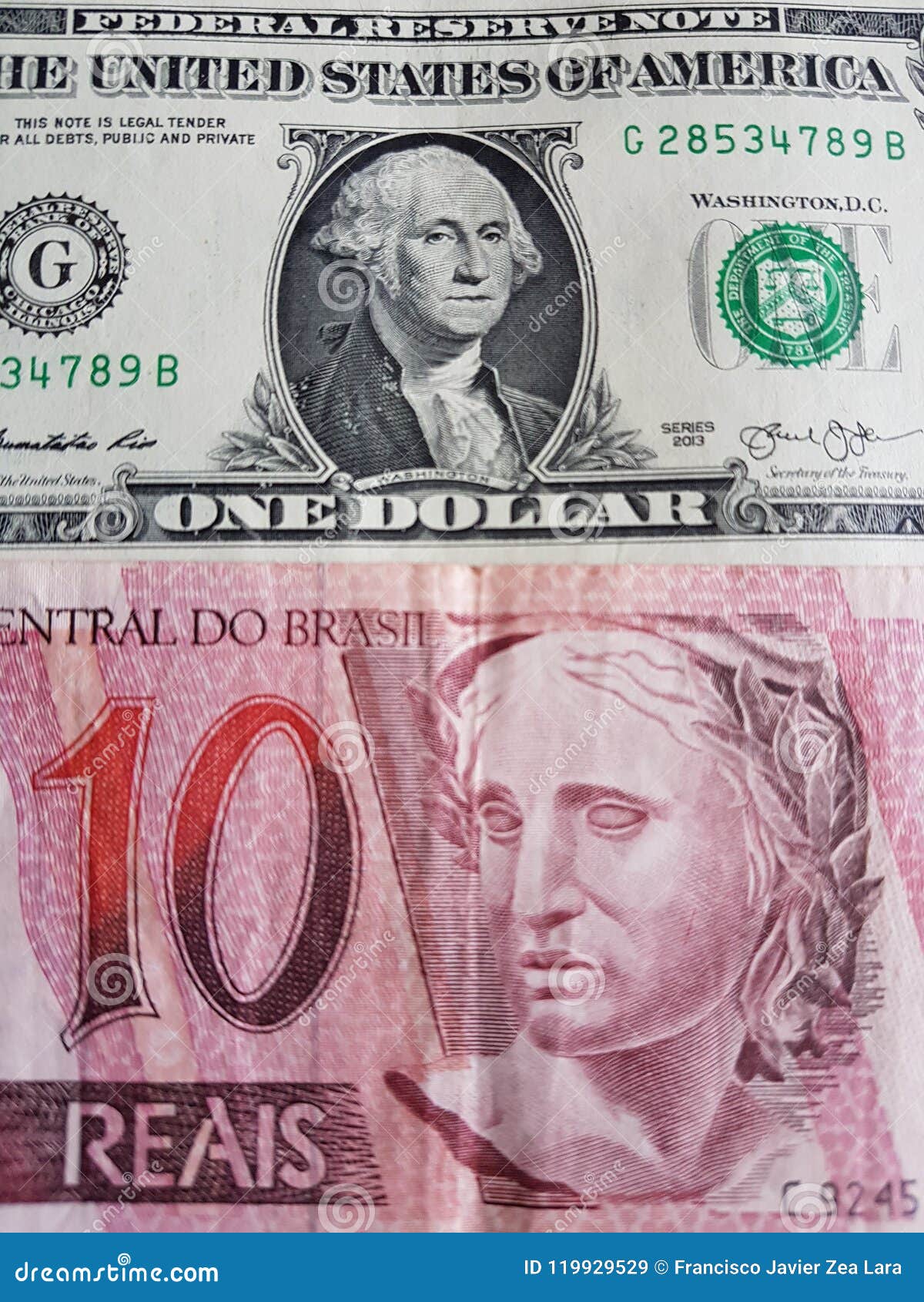 Brazilian Banknote Of 10 Reais And One American Dollar Bill Background brazilian-banknote-of-10-reais-and-one-american-dollar-bill-background