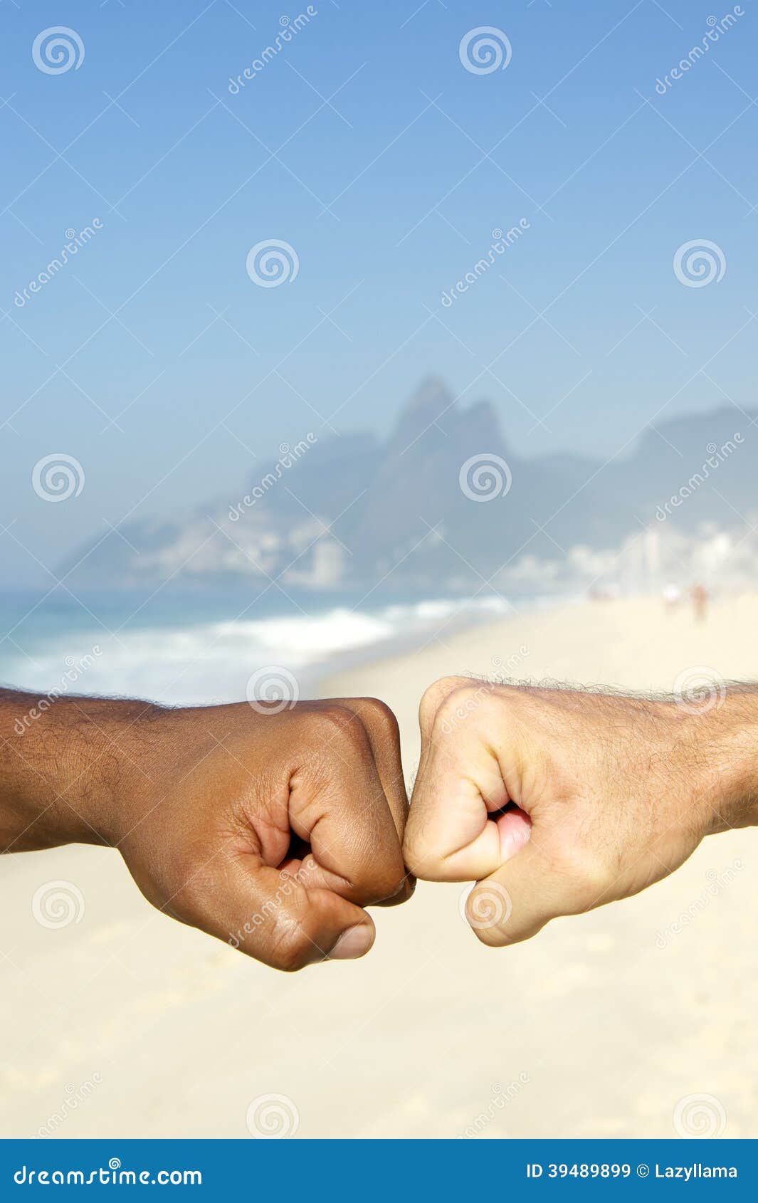 Brazilian Diversity Interracial Hands Together Rio Brazil. Fist bump Brazilian diversity interracial hands cooperating together Ipanema Beach Rio de Janeiro Brazil