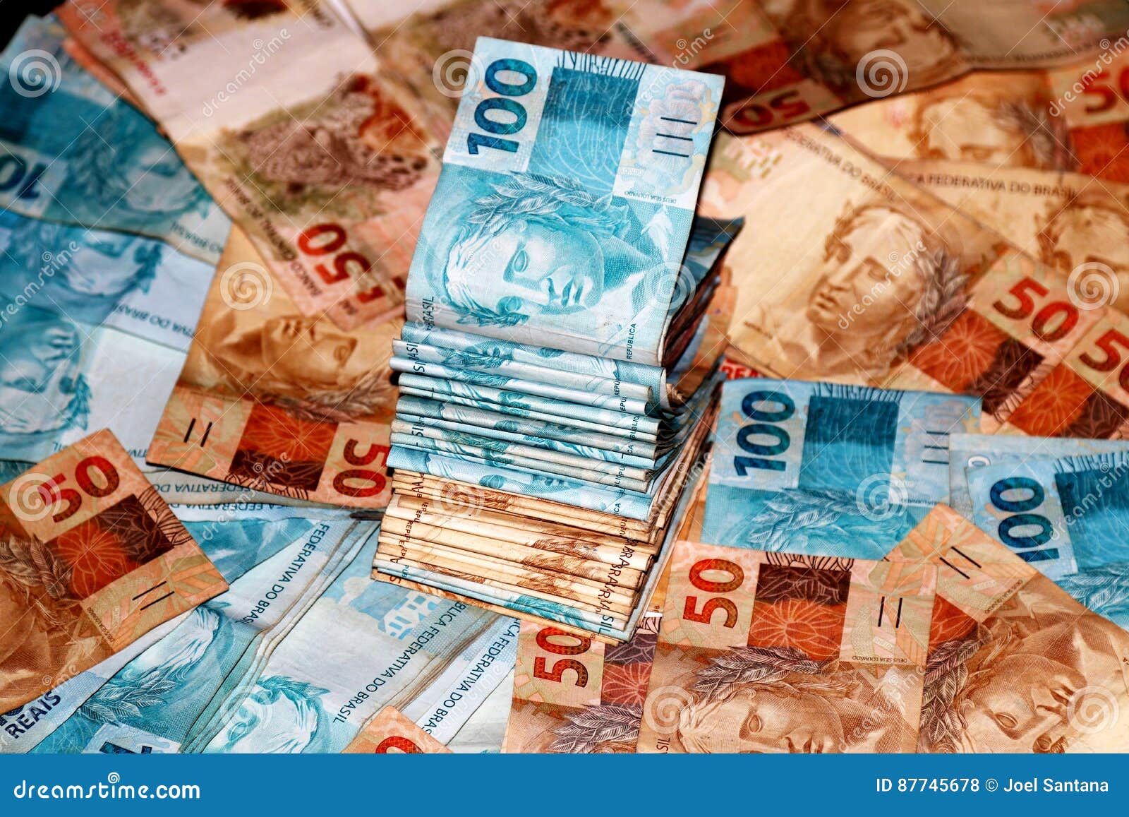 brazilian money package with 50 and 100 reais notes