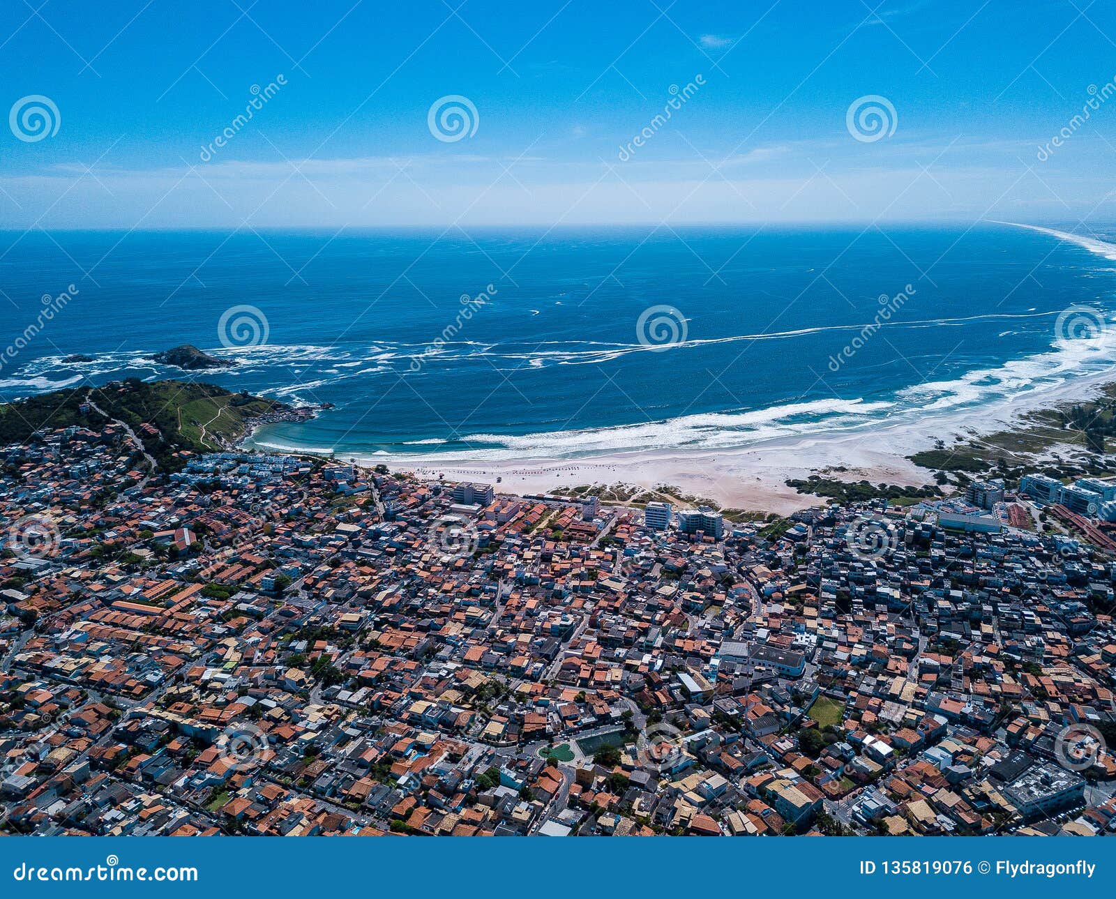 brazilian small beautiful city arraial do cabo . aerial drone photo from above city line. red roofs, narrow streets