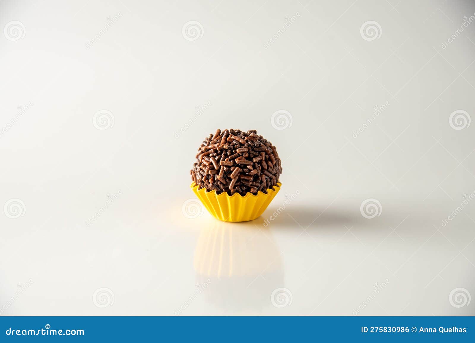 brigadeiro (brigadeiro) traditional brazilian sweet. lined up on a wooden board