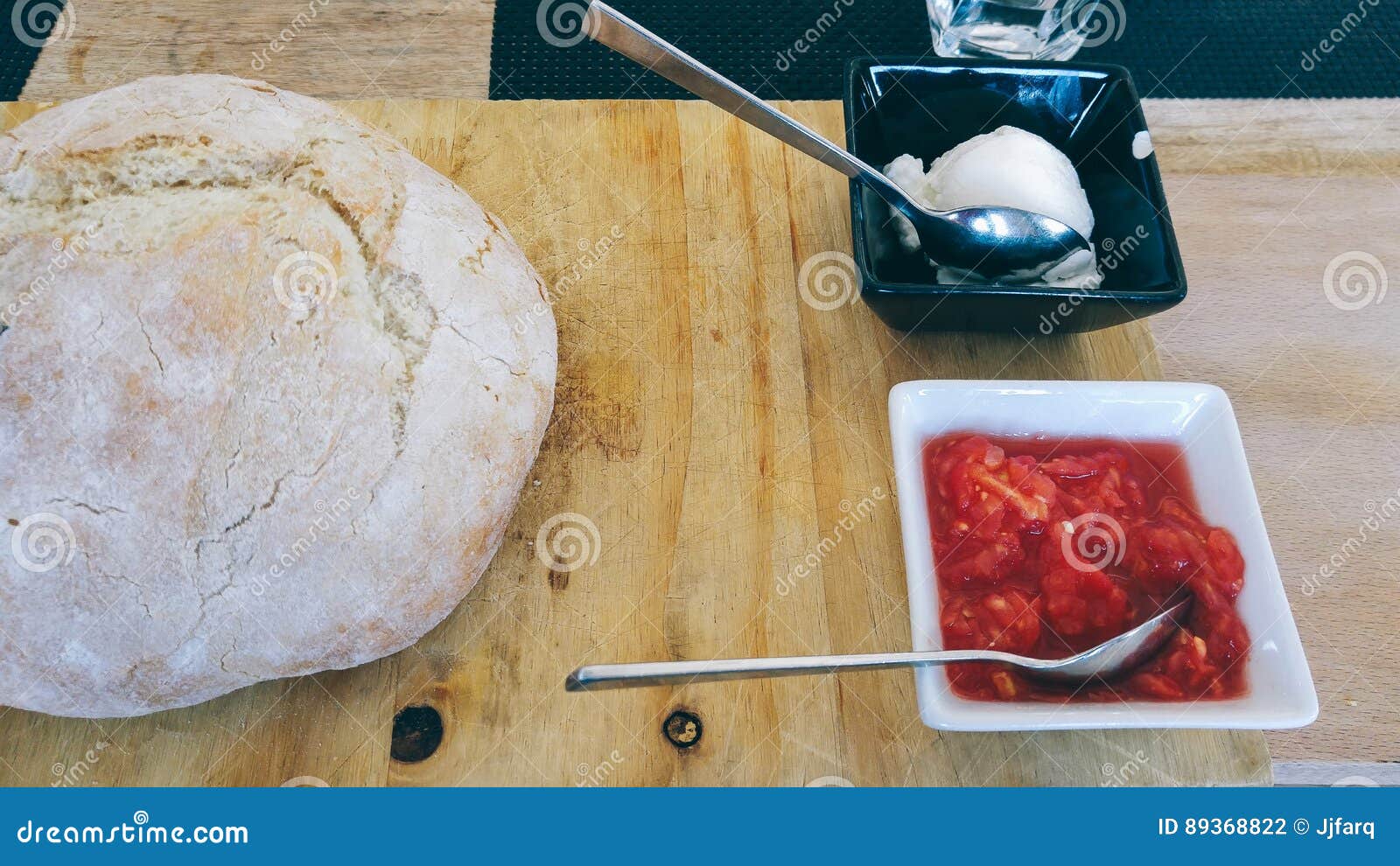 Bread Loaf, Tomato and Mayonnaise in a Restaurant on Table Stock Photo