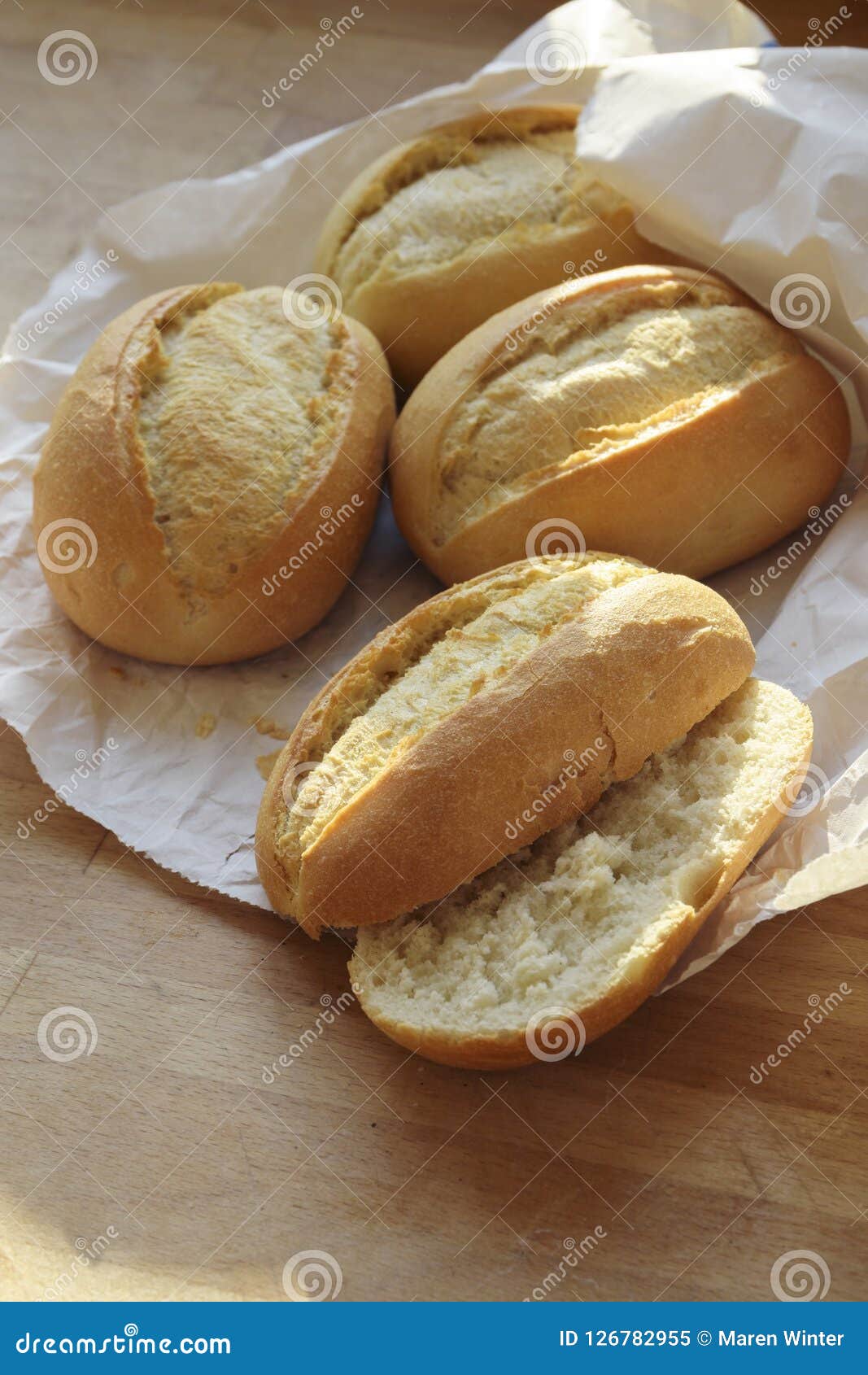 Bread Rolls or Buns Whole and Halved Fresh from the Bakery in a Stock