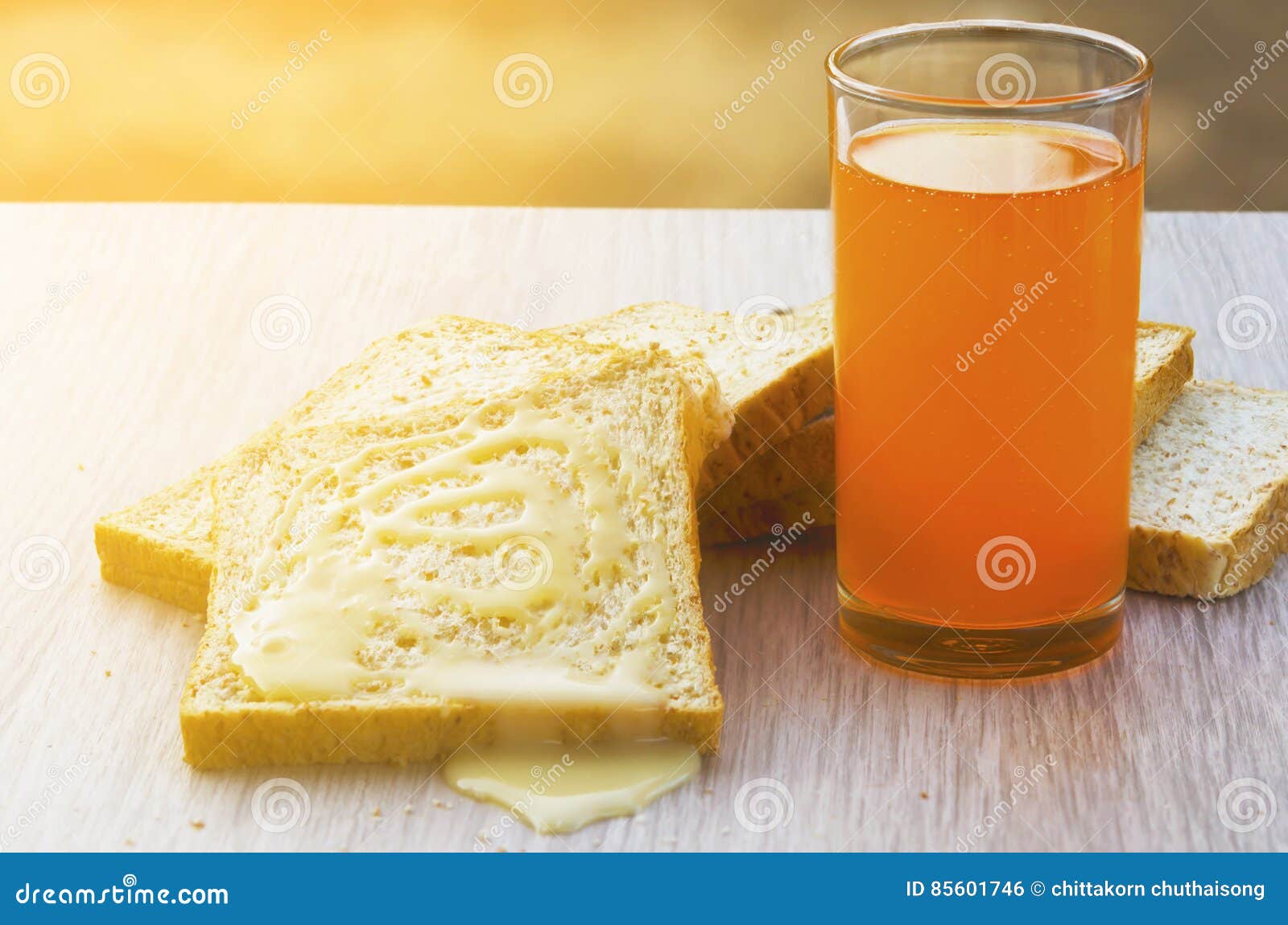 Bread, Sweetened Condensed Milk, and Orange Juice Stock Photo Image