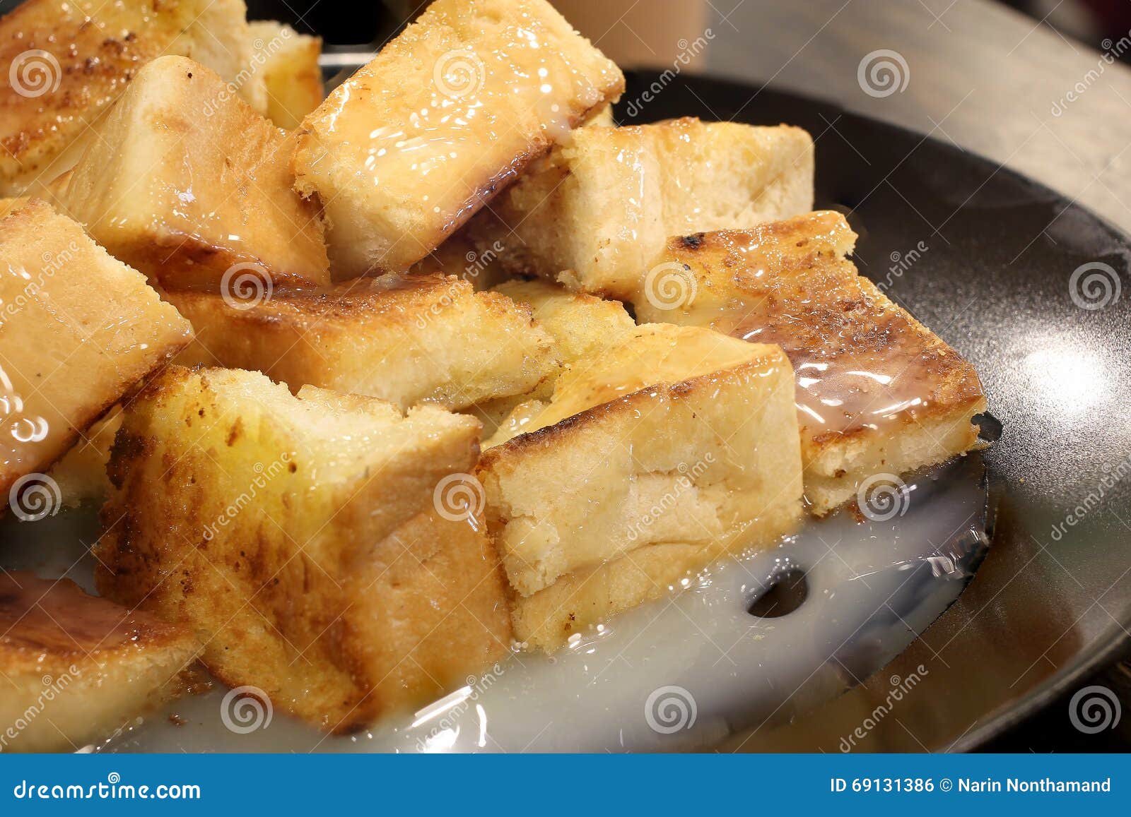 Bread Toast with Butter and Condensed Milk in a Plate, Select Focus