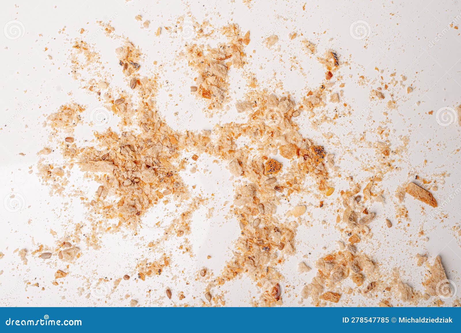 Breadcrumbs Laying on White Table. Dried Bread Background Stock Image