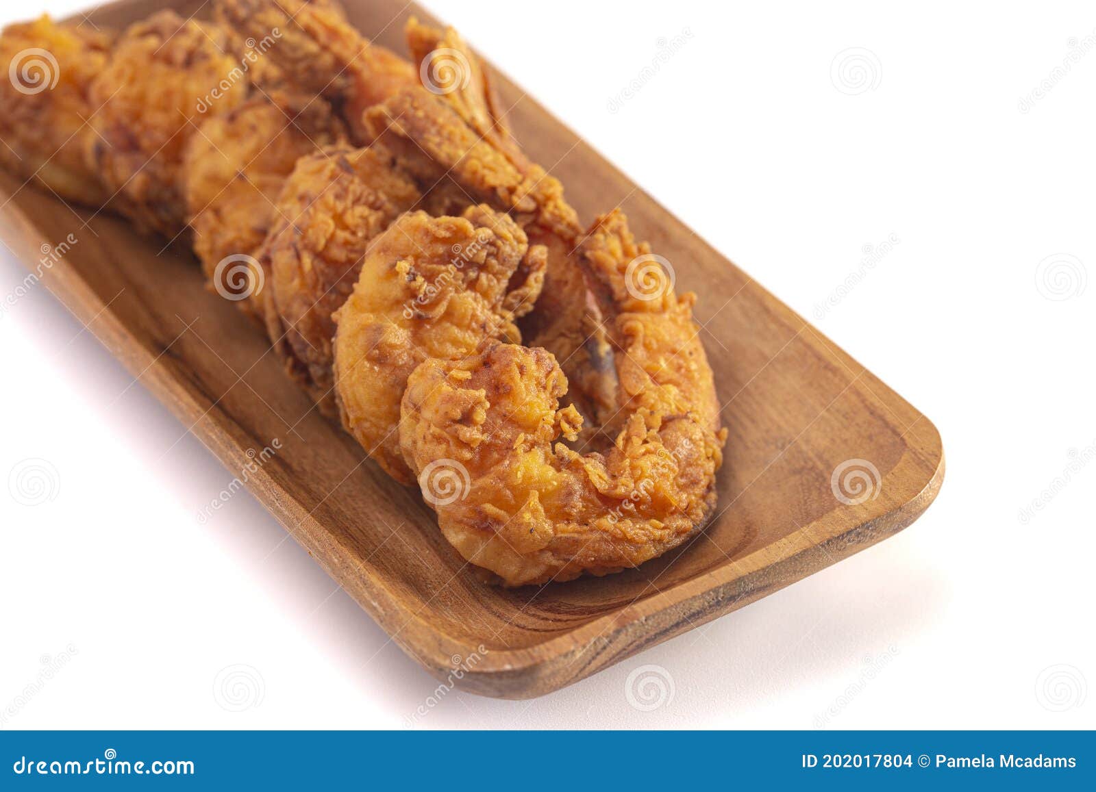 Breaded and Fried Jumbo Shrimp with Tails on a White Background Stock