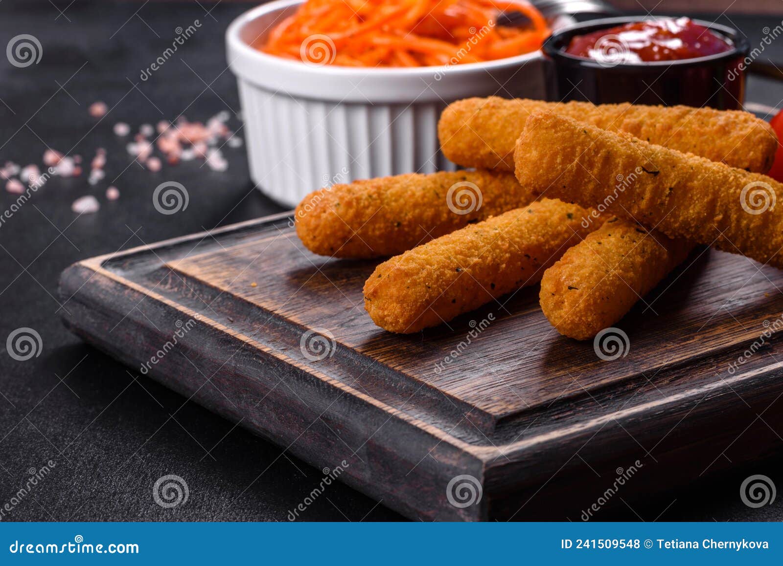 Breaded Mozzarella Cheese Sticks Served with Tomato Sauce Stock Photo
