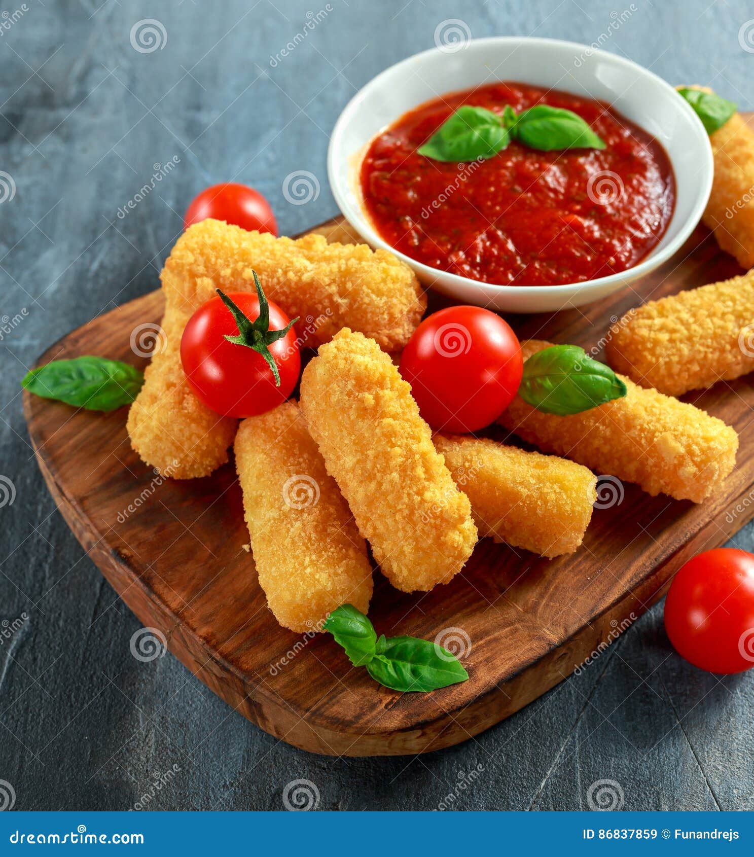 Breaded Mozzarella Cheese Sticks with Tomato Basil Sauce Stock Image