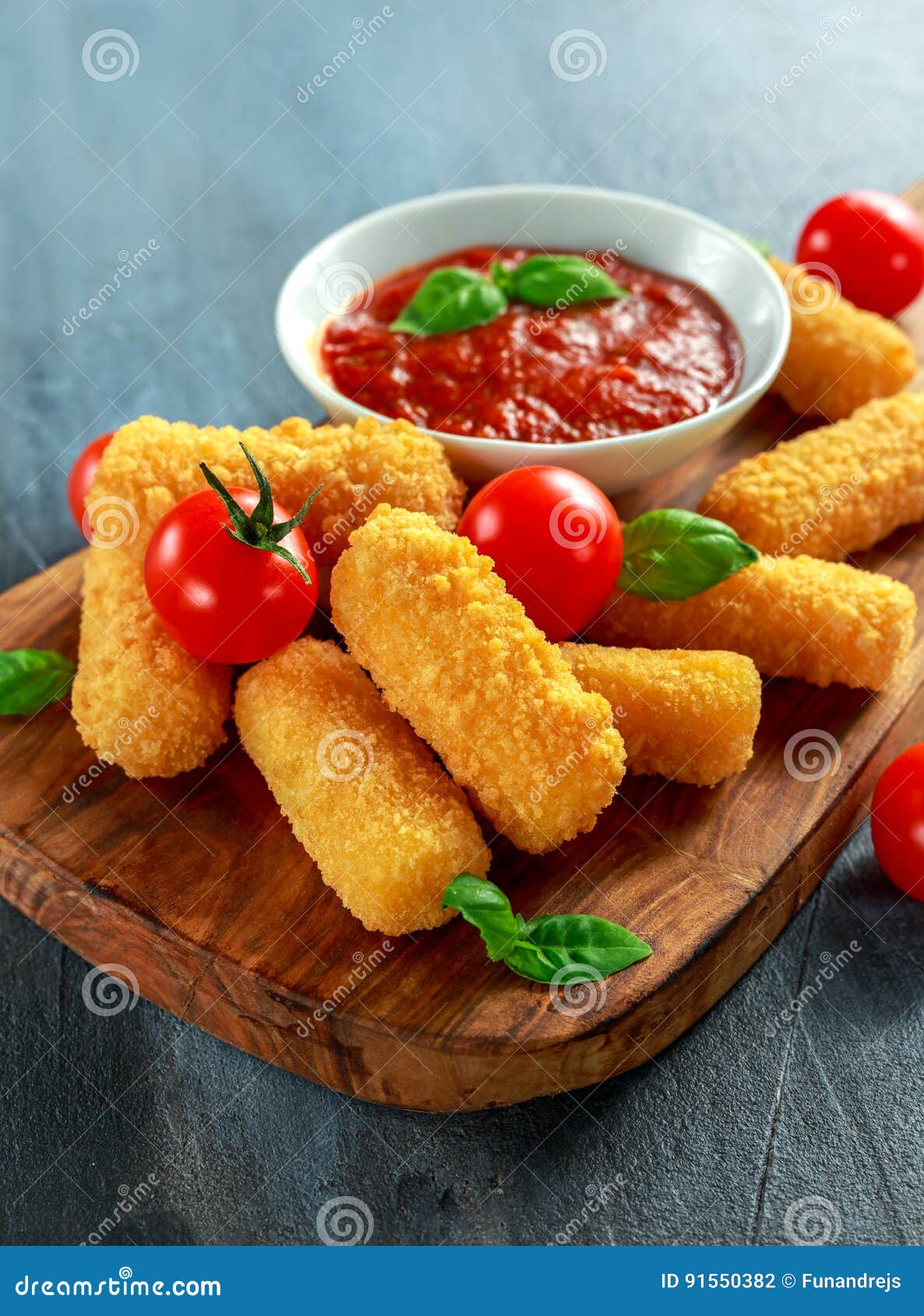 Breaded Mozzarella Cheese Sticks with Tomato Basil Sauce Stock Photo