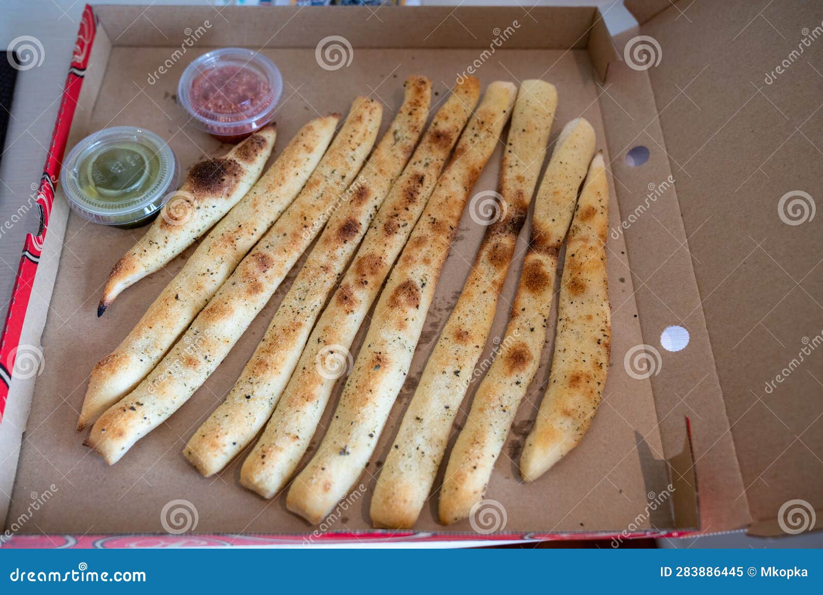 Breadsticks and Dipping Sauce in a Pizza Box Stock Image Image of