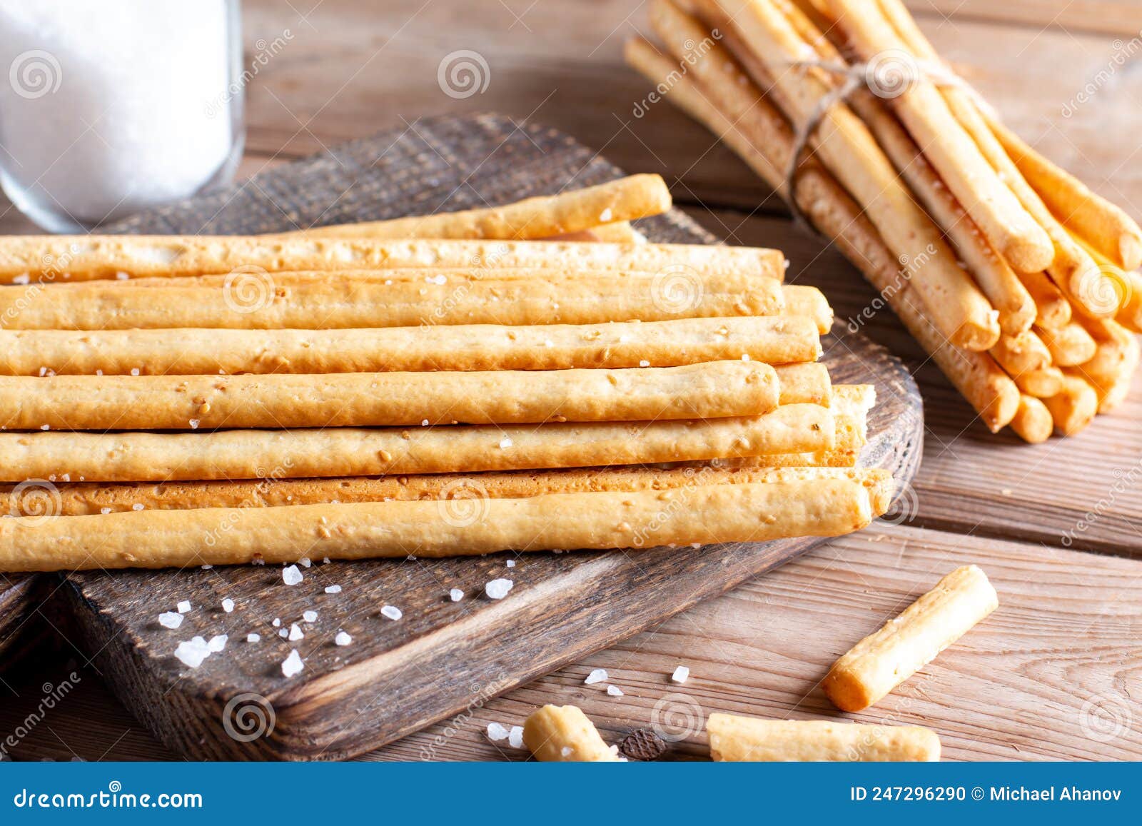 Breadsticks Grissini. Bread Sticks with Salt on Table Stock Photo