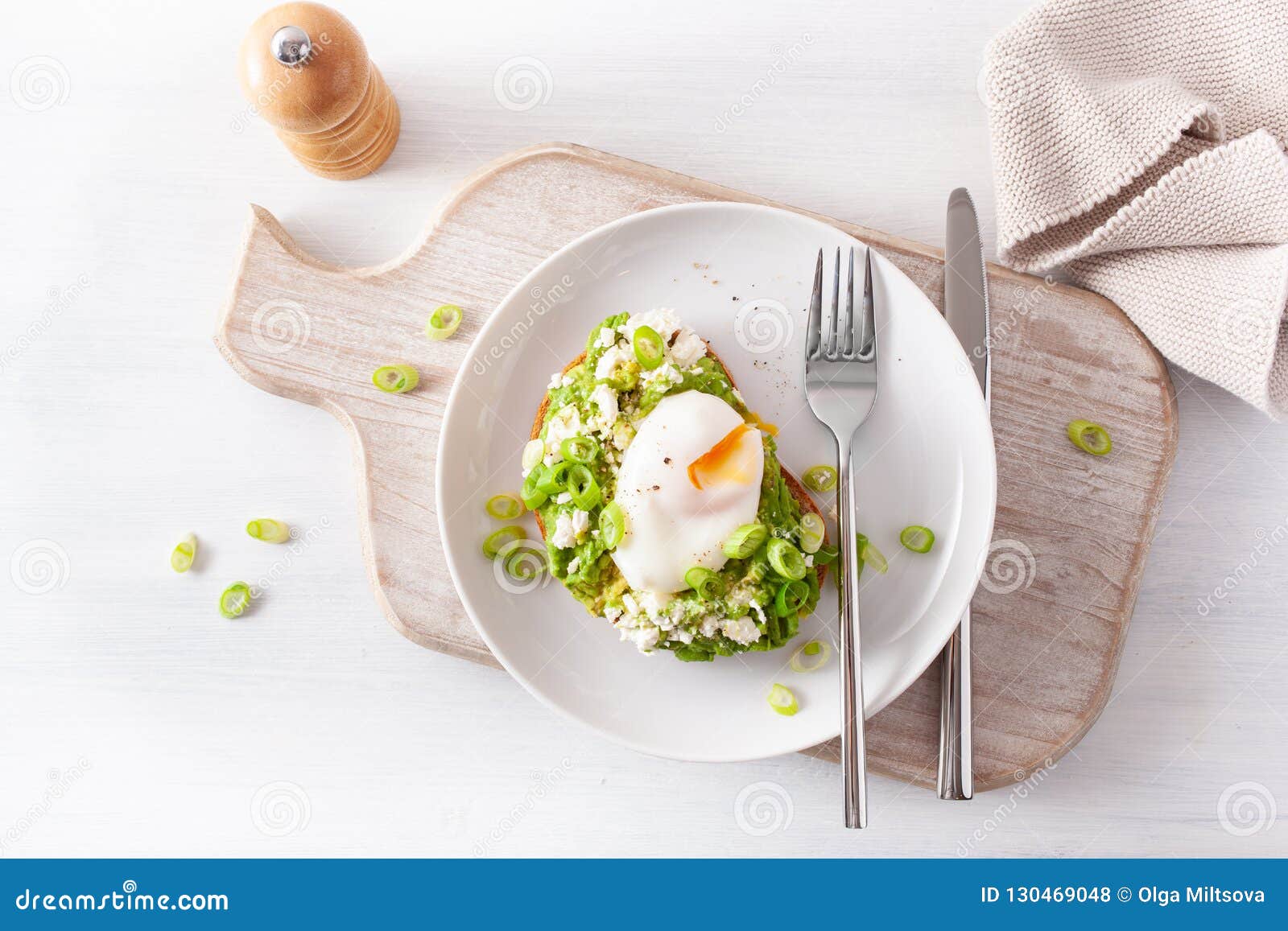 Breakfast Avocado Sandwich with Poached Egg and Feta Cheese Stock Photo
