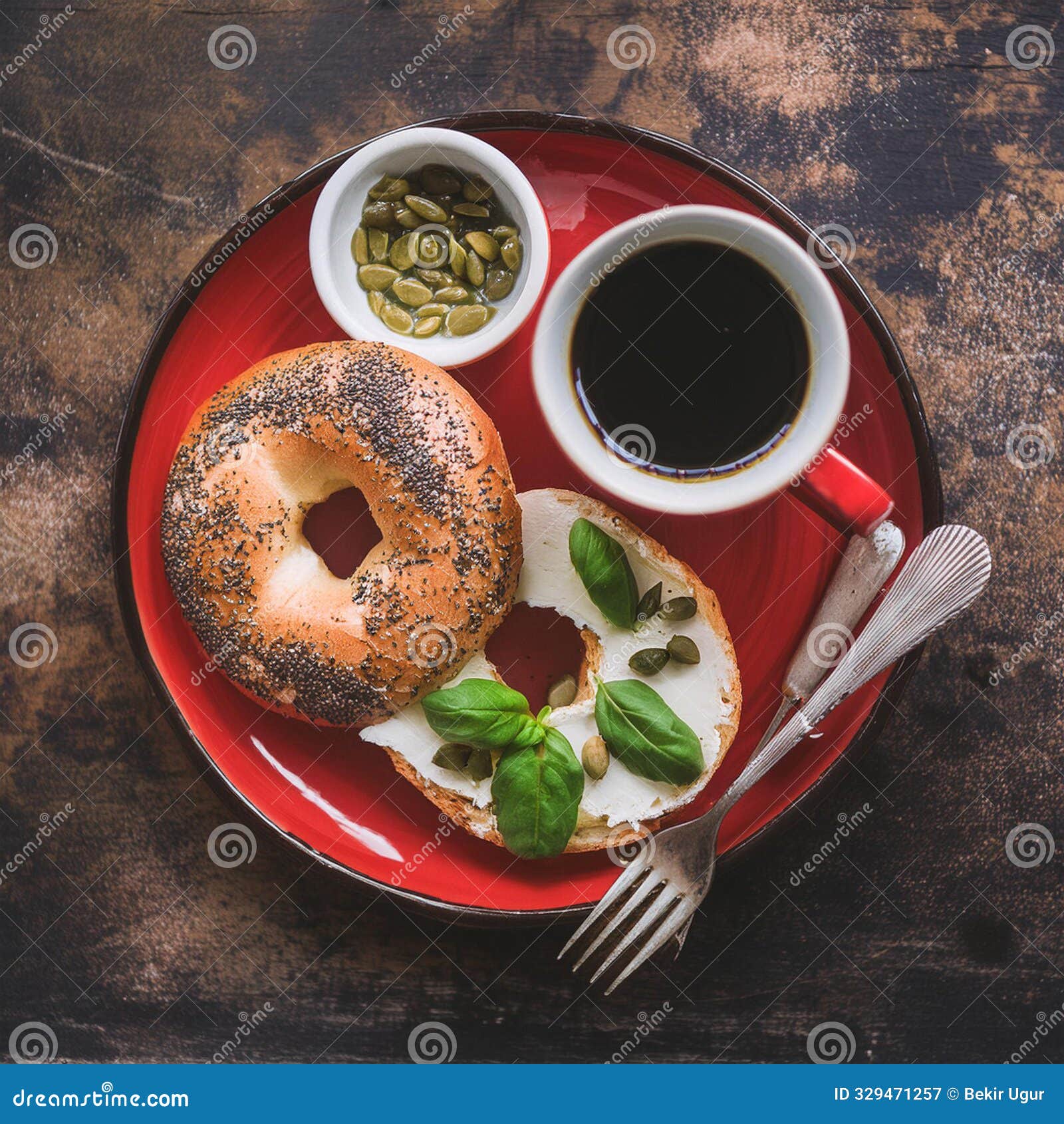 breakfast with bagel, espresso coffee and capers in red bowl