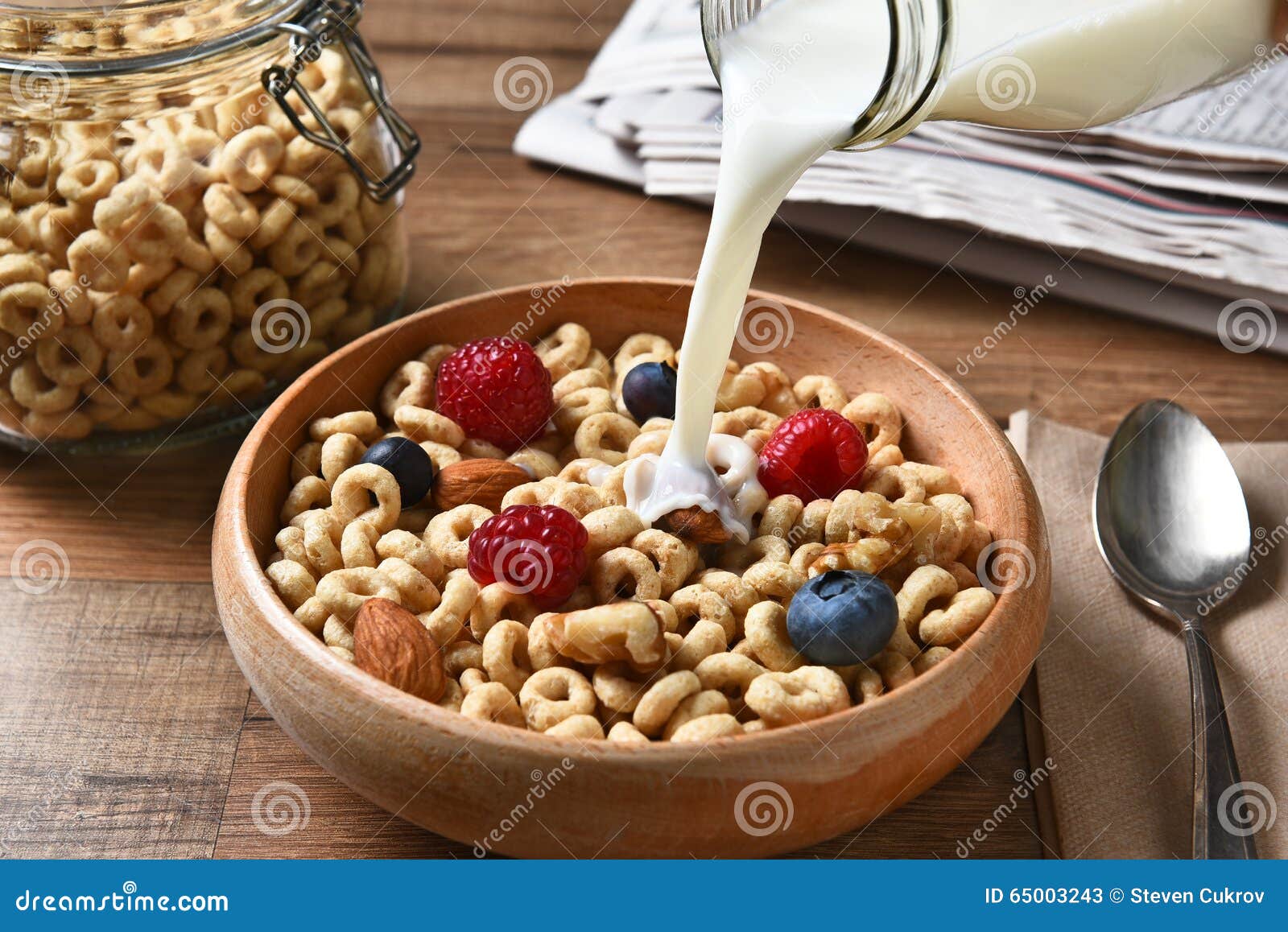 https://thumbs.dreamstime.com/z/breakfast-cereal-milk-pour-high-angle-view-bowl-blueberries-raspberries-nuts-bottle-pouring-bowl-65003243.jpg