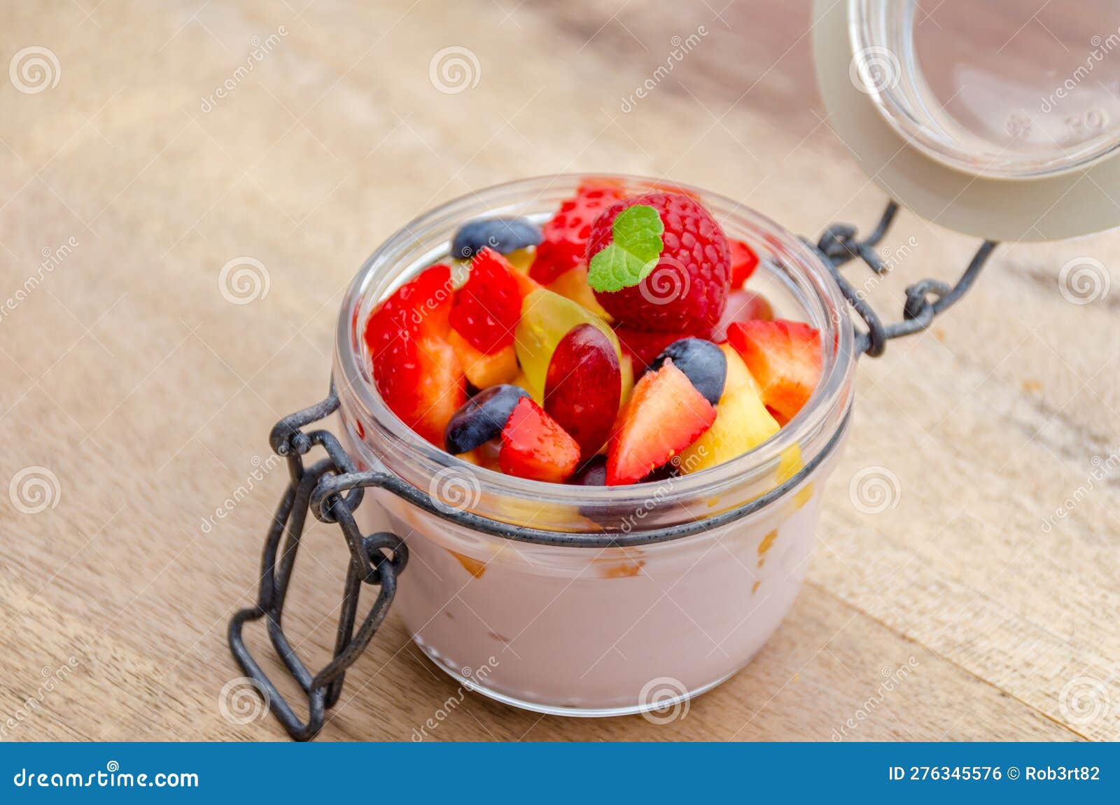 Breakfast with Creamy Yogurt and Fresh Fruit in a Jar Stock Photo