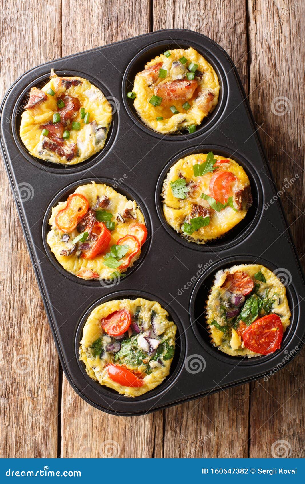 Breakfast Egg Muffins with Bacon, Tomatoes, Spinach and Mushrooms Close
