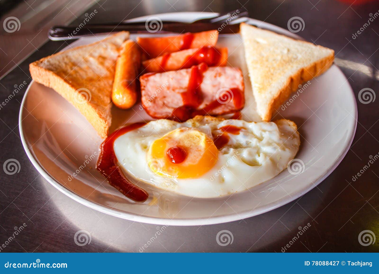 Breakfast with Fried Eggs, Ham and Sausages. Stock Image - Image of
