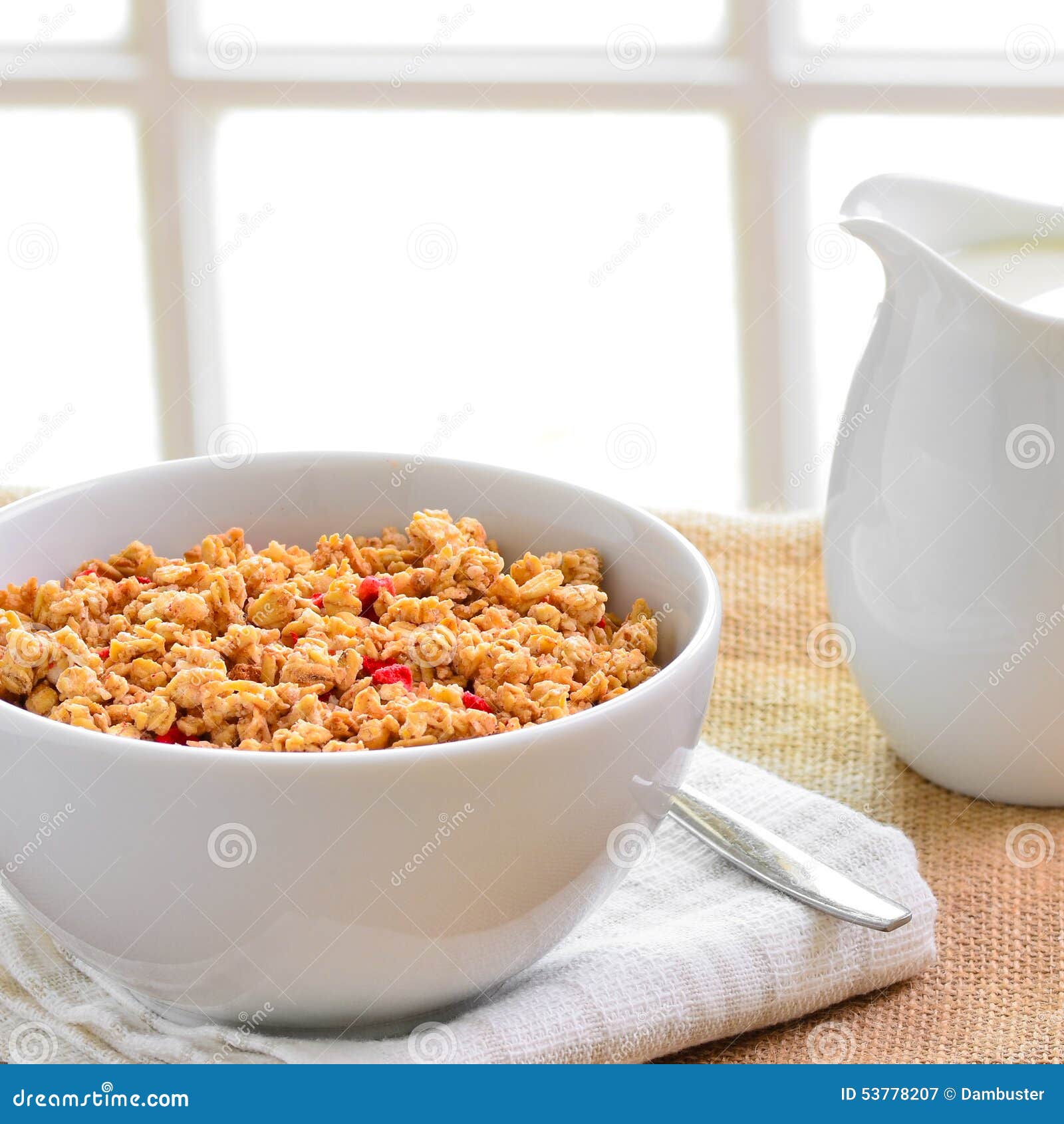 Breakfast Muesli Cereal Clusters with a Jug of Fresh Milk. Stock Image