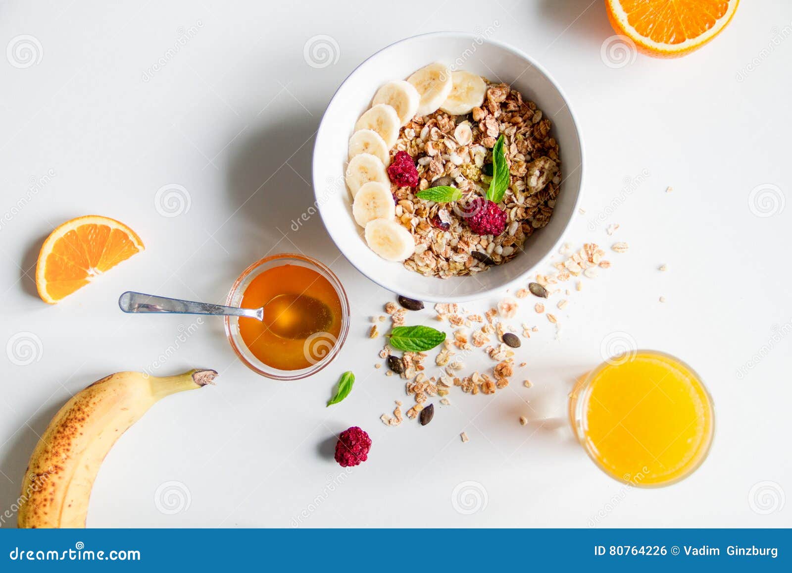 Breakfast with Oatmeal and Orange Juice on White Background Stock Photo