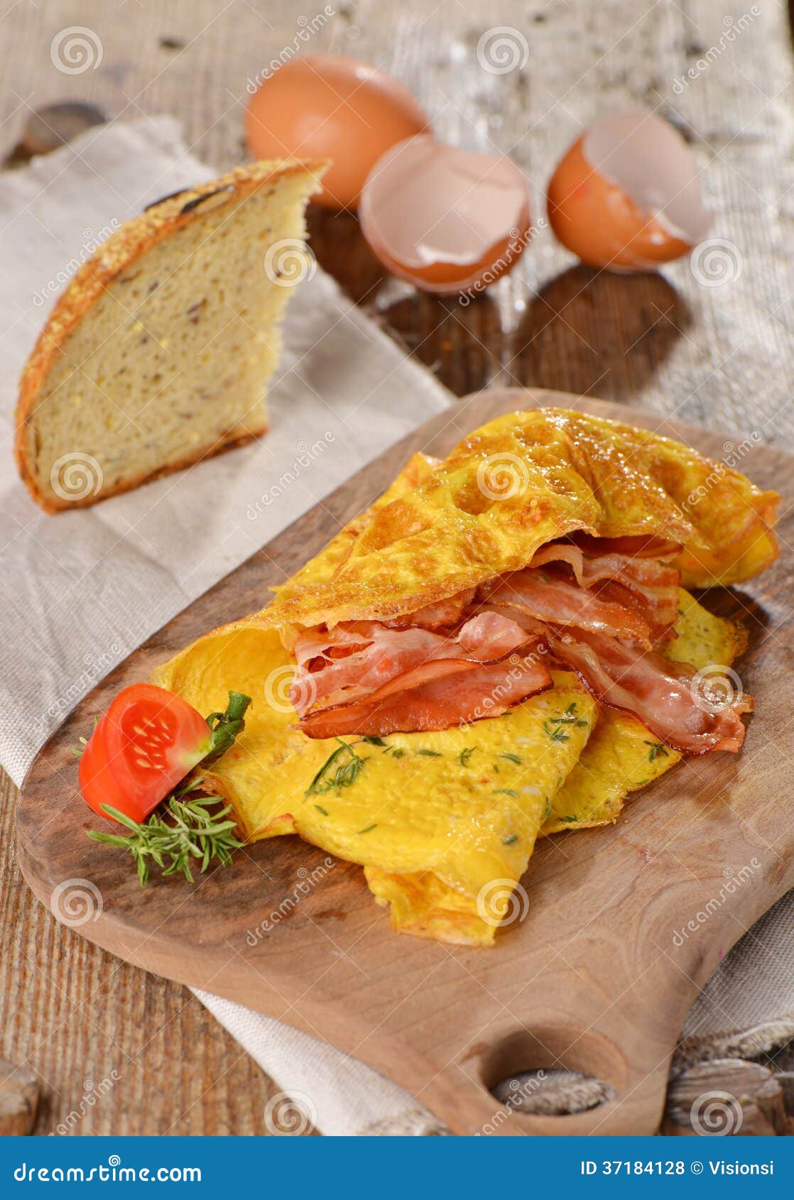breakfast omelette with ham, bacon