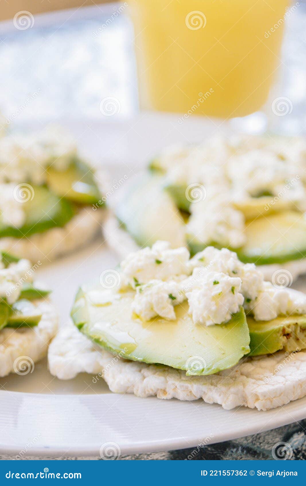 Breakfast of Puffed Wheat Toast with Avocado and Fresh Cheese Stock