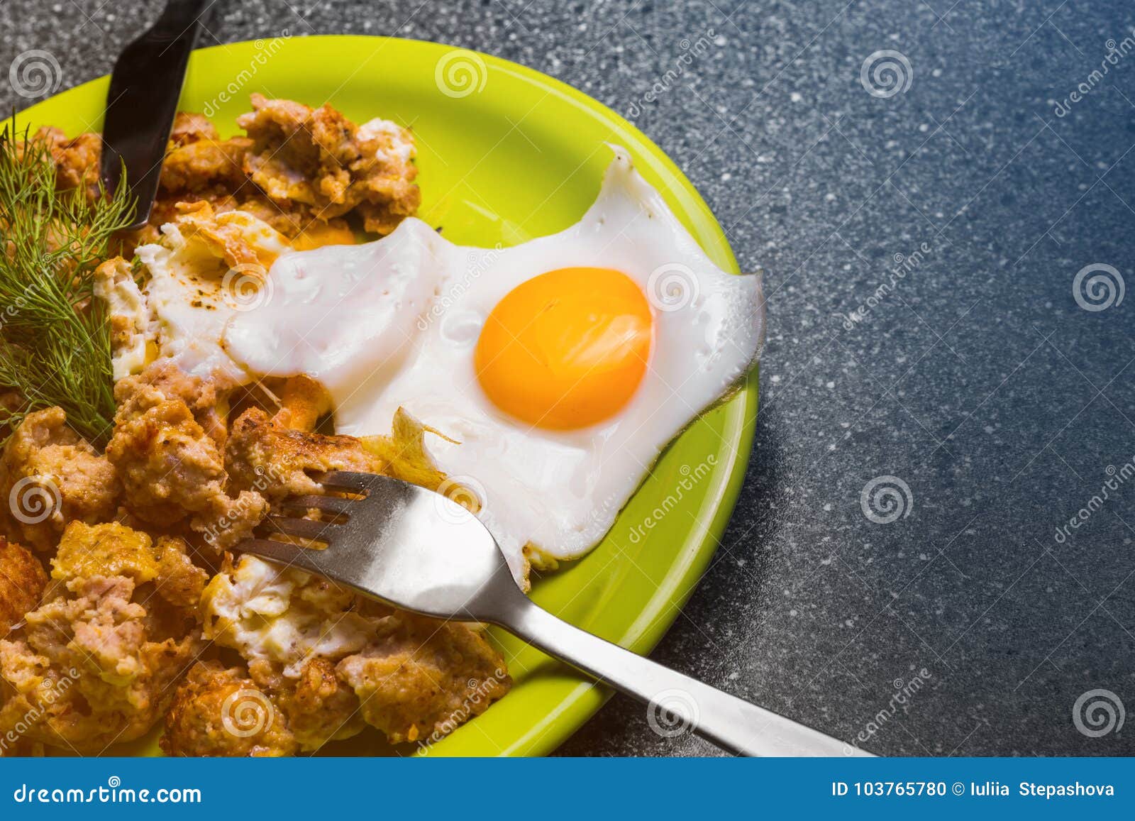 Breakfast Roast Beef and Fried Eggs on a Gray Background. Stock Photo