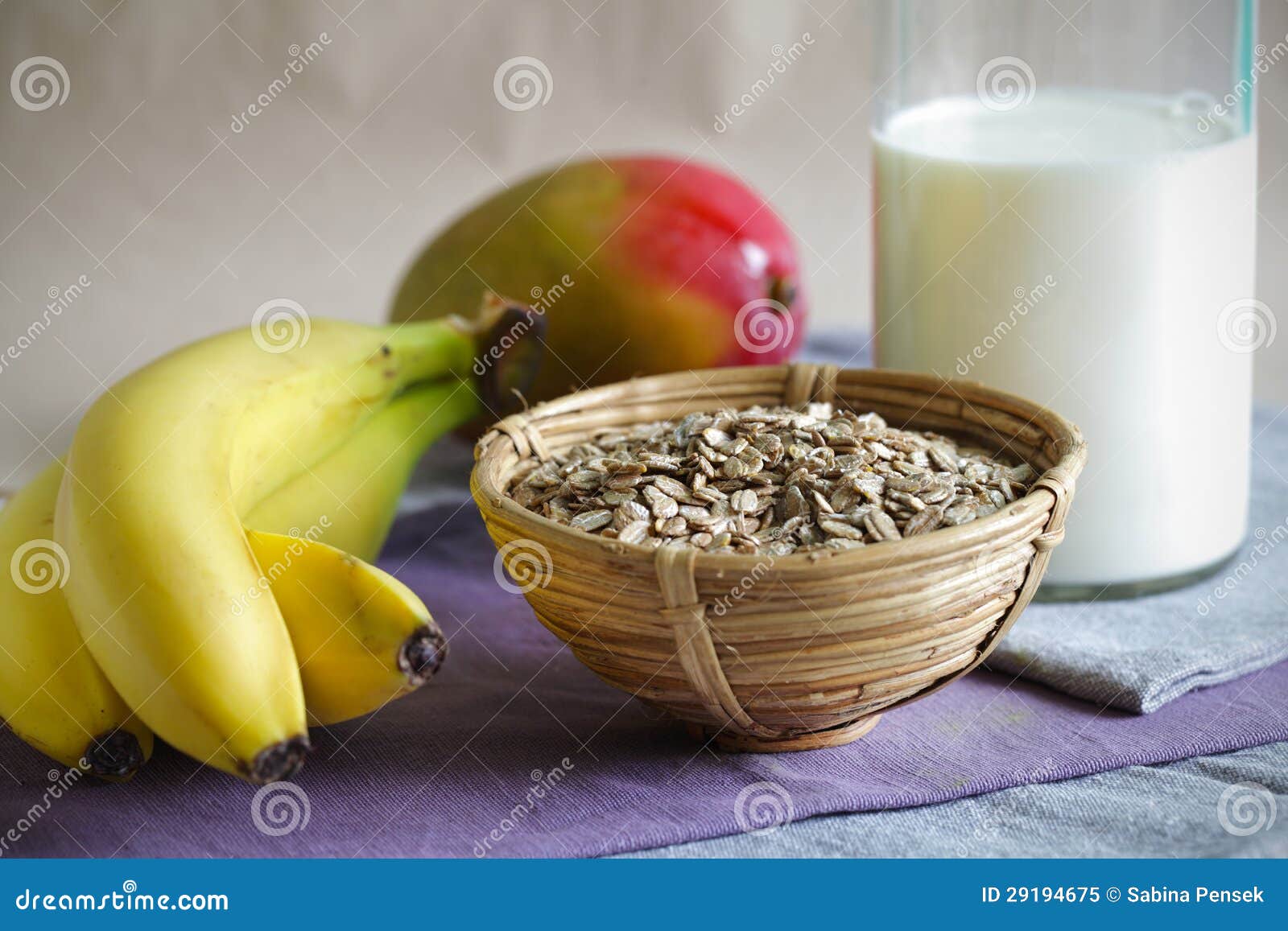 Breakfast with Rolled Oatmeal, Bananas, Mango and Milk Stock Image