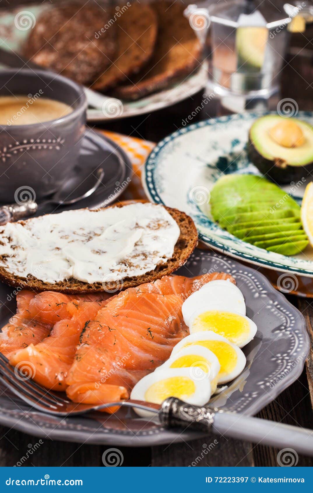 Breakfast with Salmon, Eggs, Avocado, Bread, Cheese and Coffee Stock