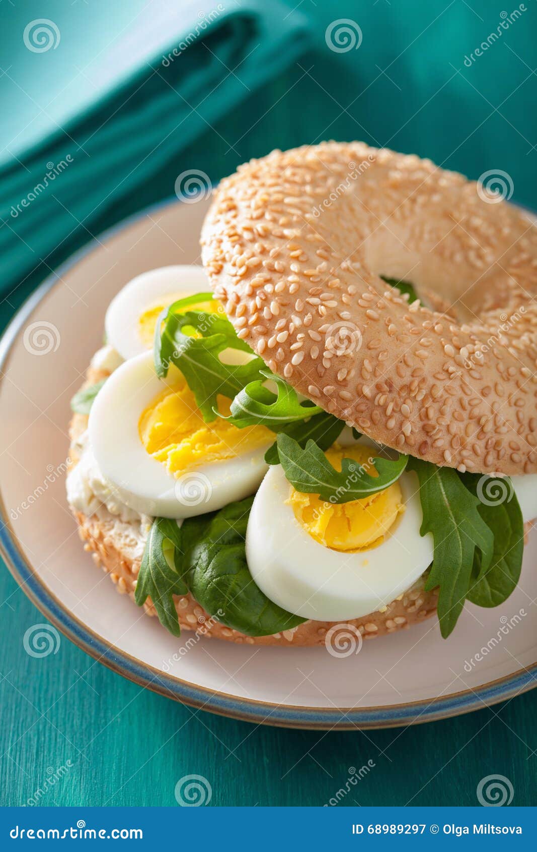 Breakfast Sandwich on Bagel with Egg Cream Cheese Arugula Stock Image