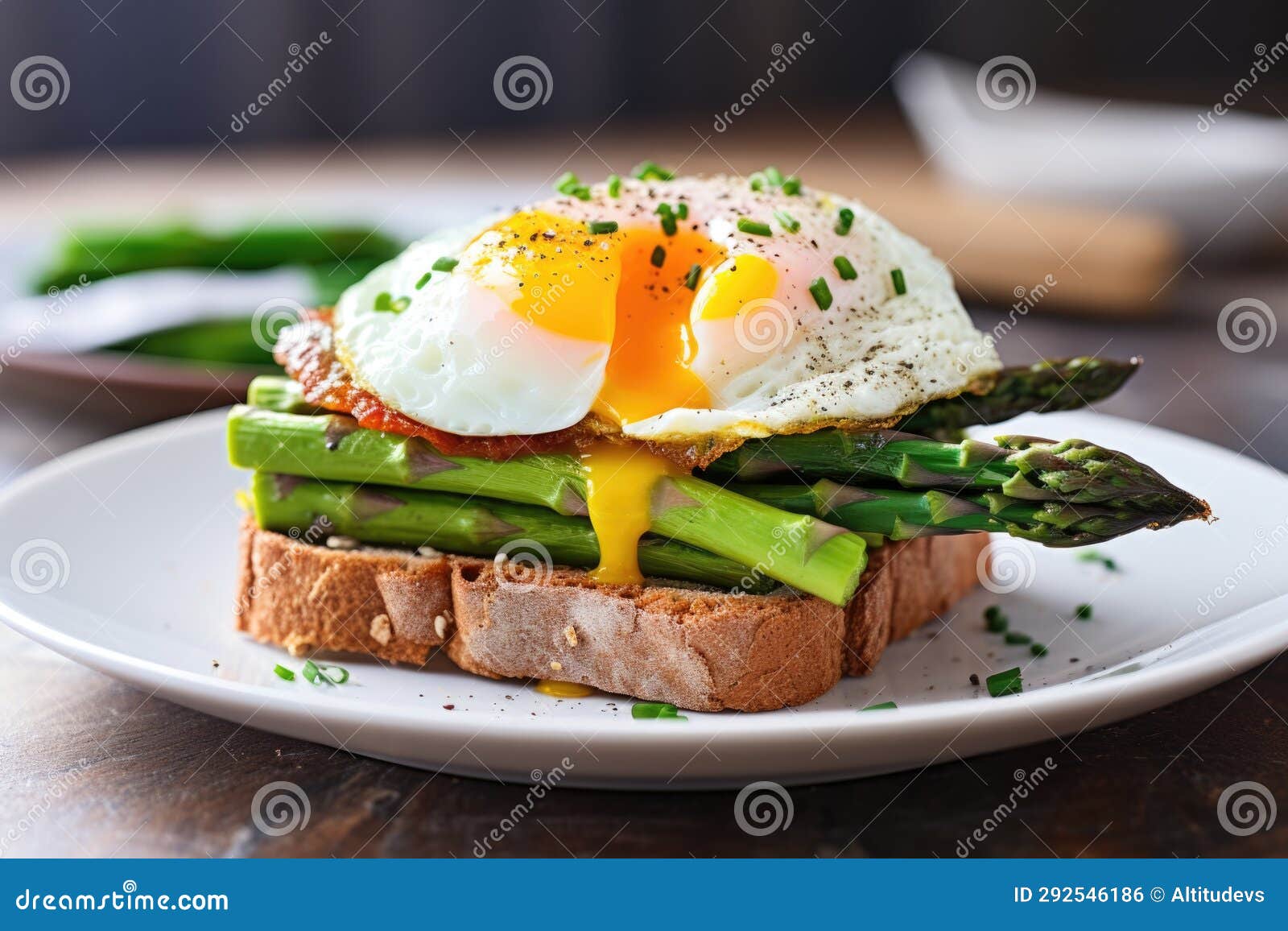 A Breakfast Sandwich with a Poached Egg and Asparagus Stock Photo