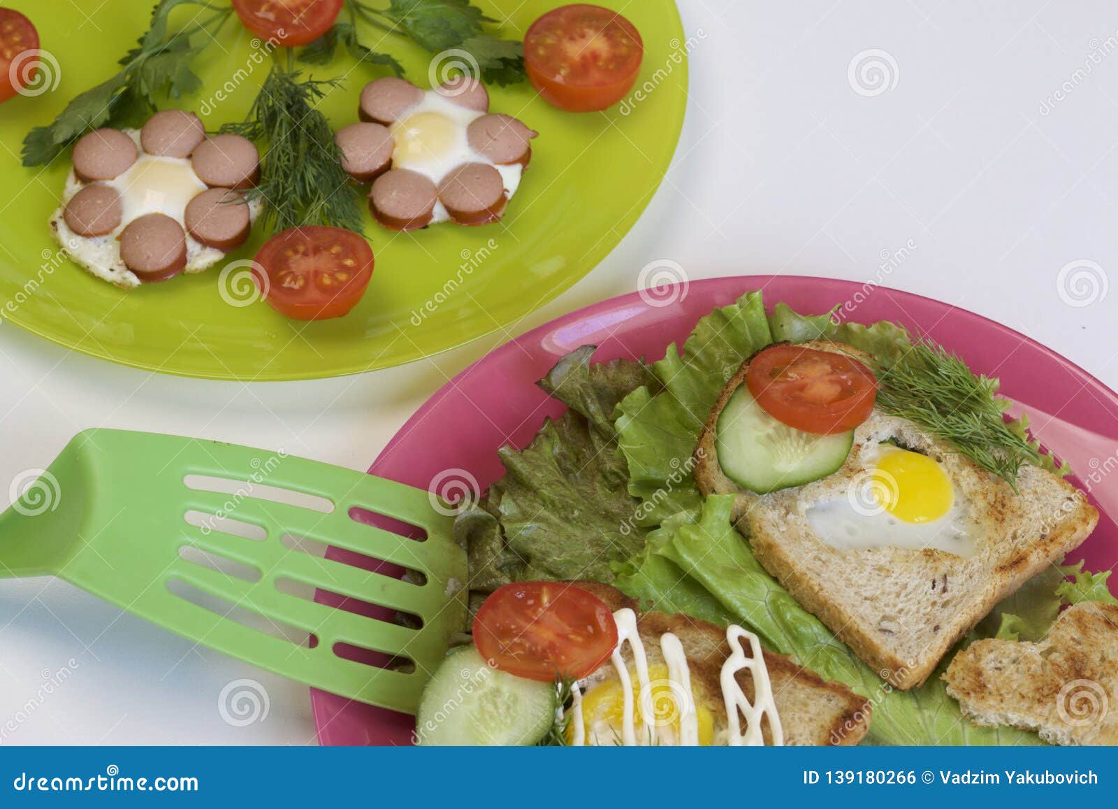 Breakfast of Sausages, Quail Eggs, Herbs and Vegetables Stock Photo
