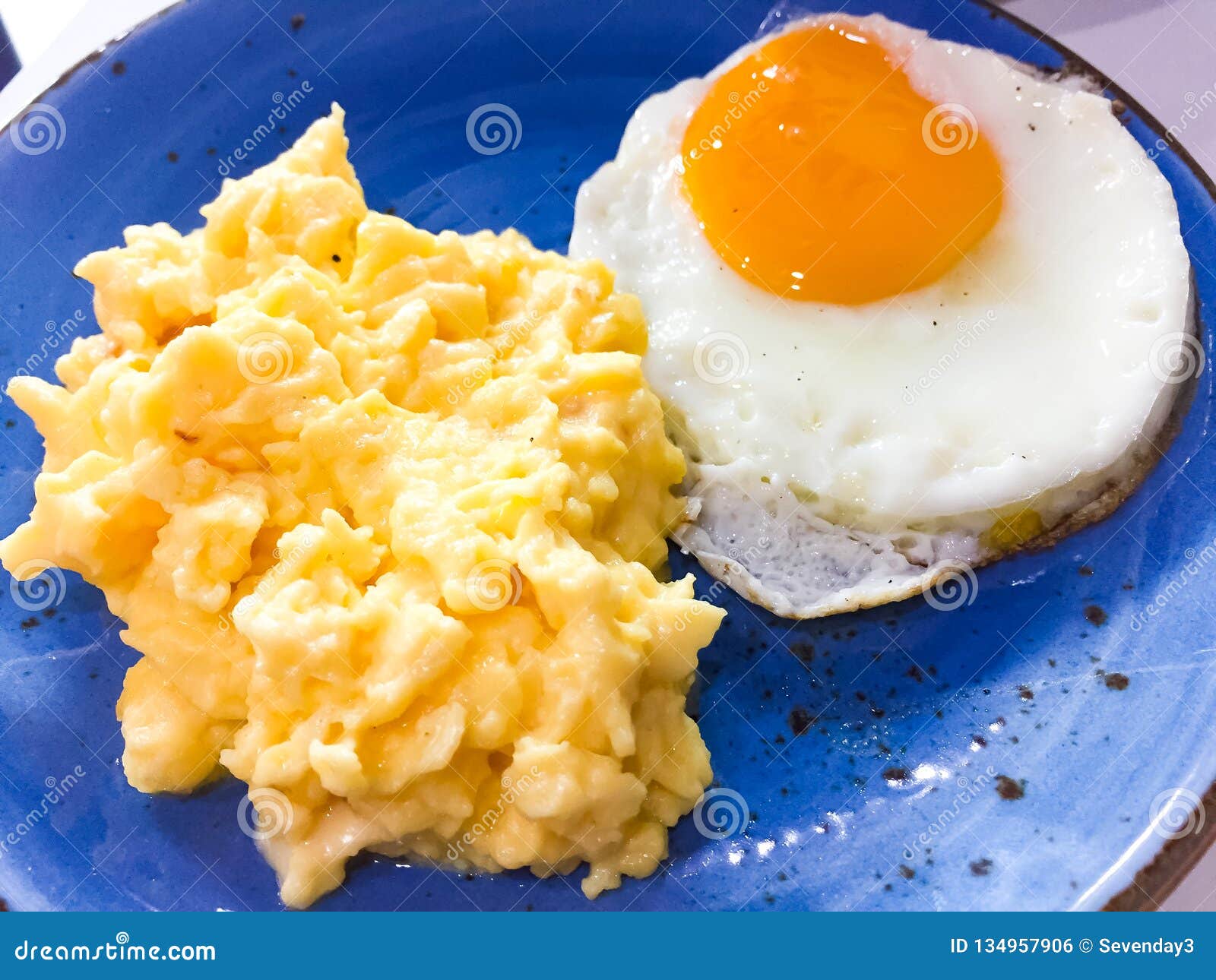 Breakfast Scrambled Eggs With Chees And Medium Fried Egg That Was Placed On The Blue Dish Stock Photo Image Of Life Food