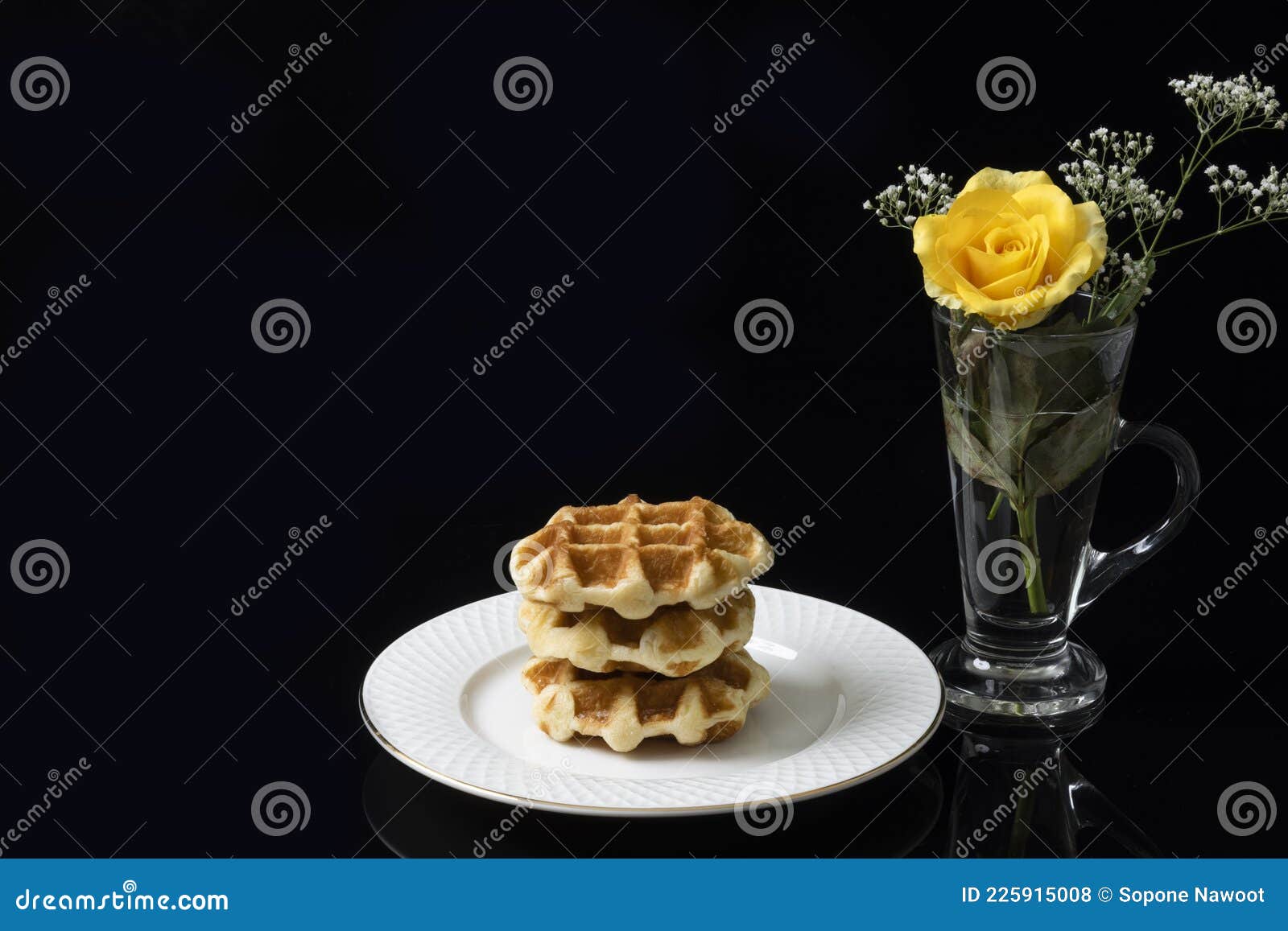 Breakfast Table Consisting of a Stack of Golden Waffles Stock Photo