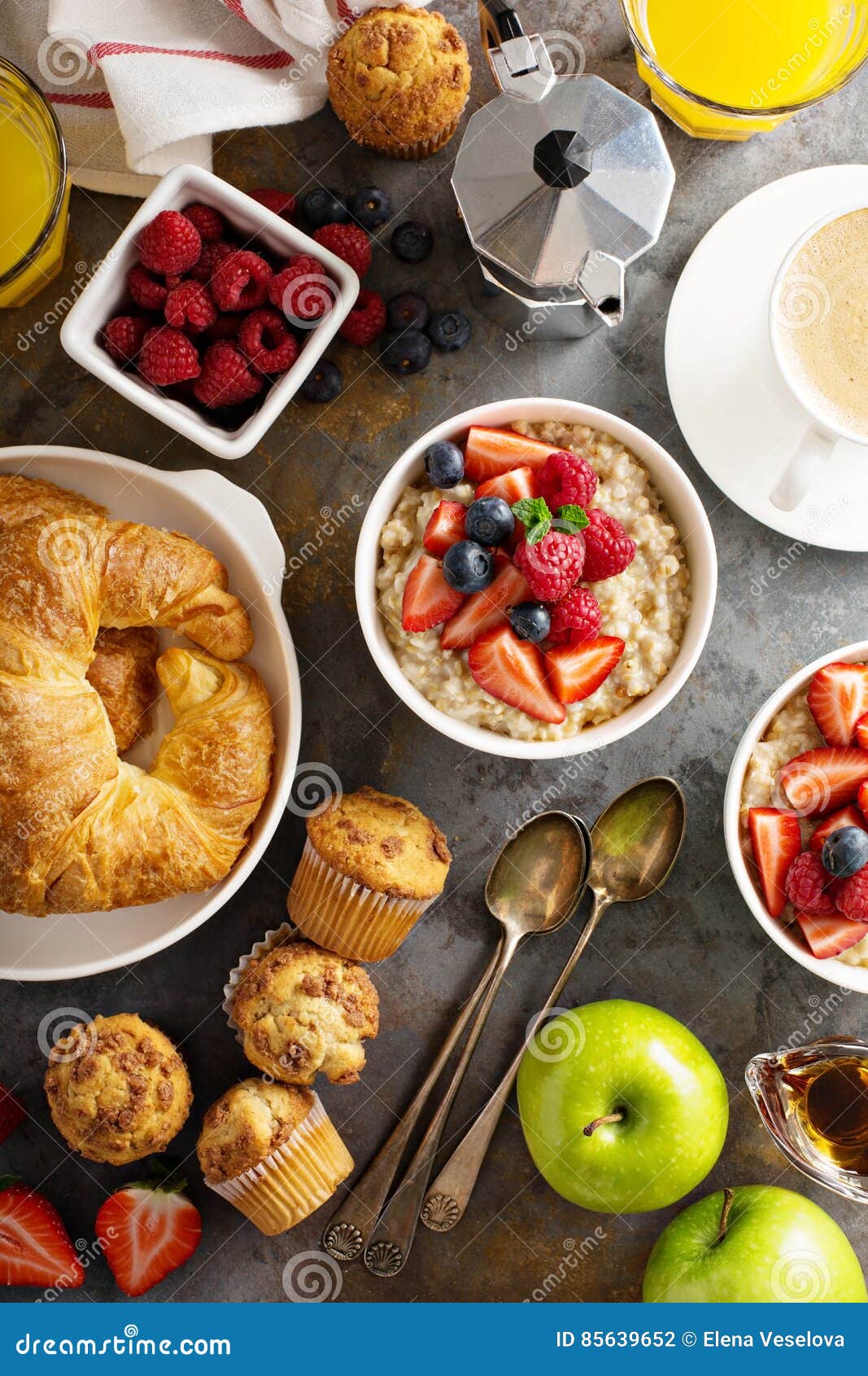 Breakfast Table with Oatmeal Porridge, Croissants and Muffins Stock ...