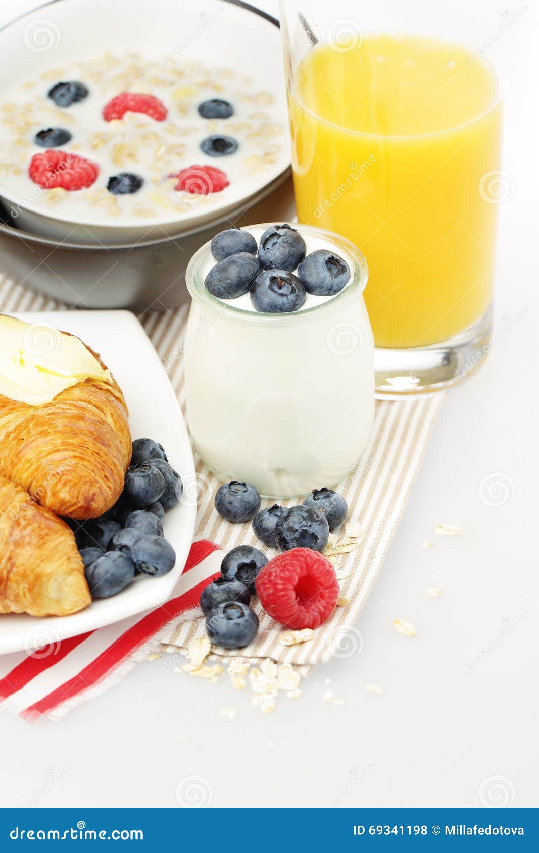Breakfast. Yogurt, Orange Juice, Berries and Croissant Stock Photo