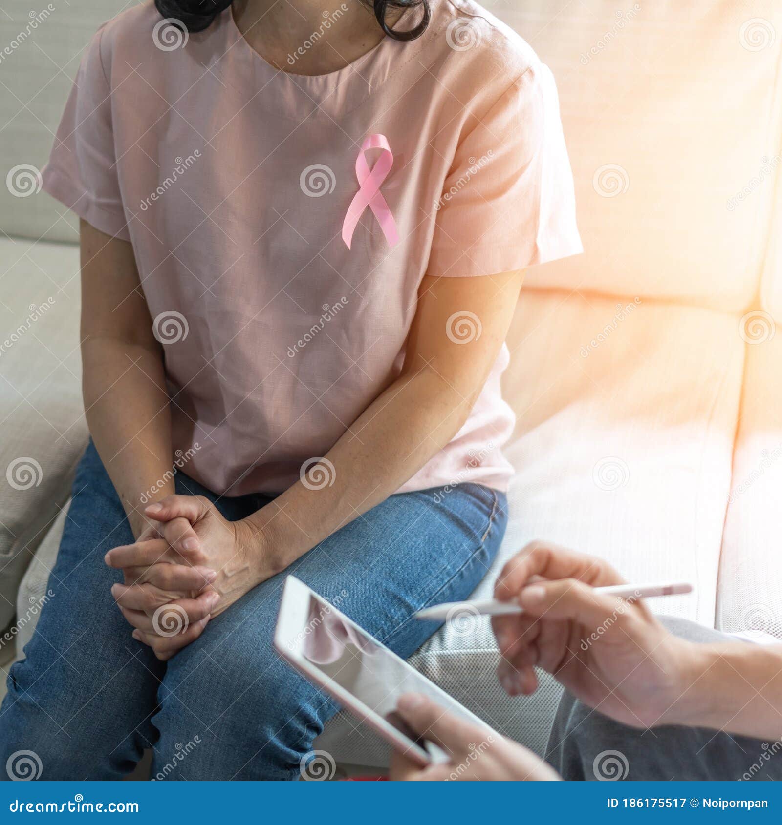 breast cancer pink awareness ribbon on woman patient consulting with doctor who diagnostic examining on obstetric - gynaecological