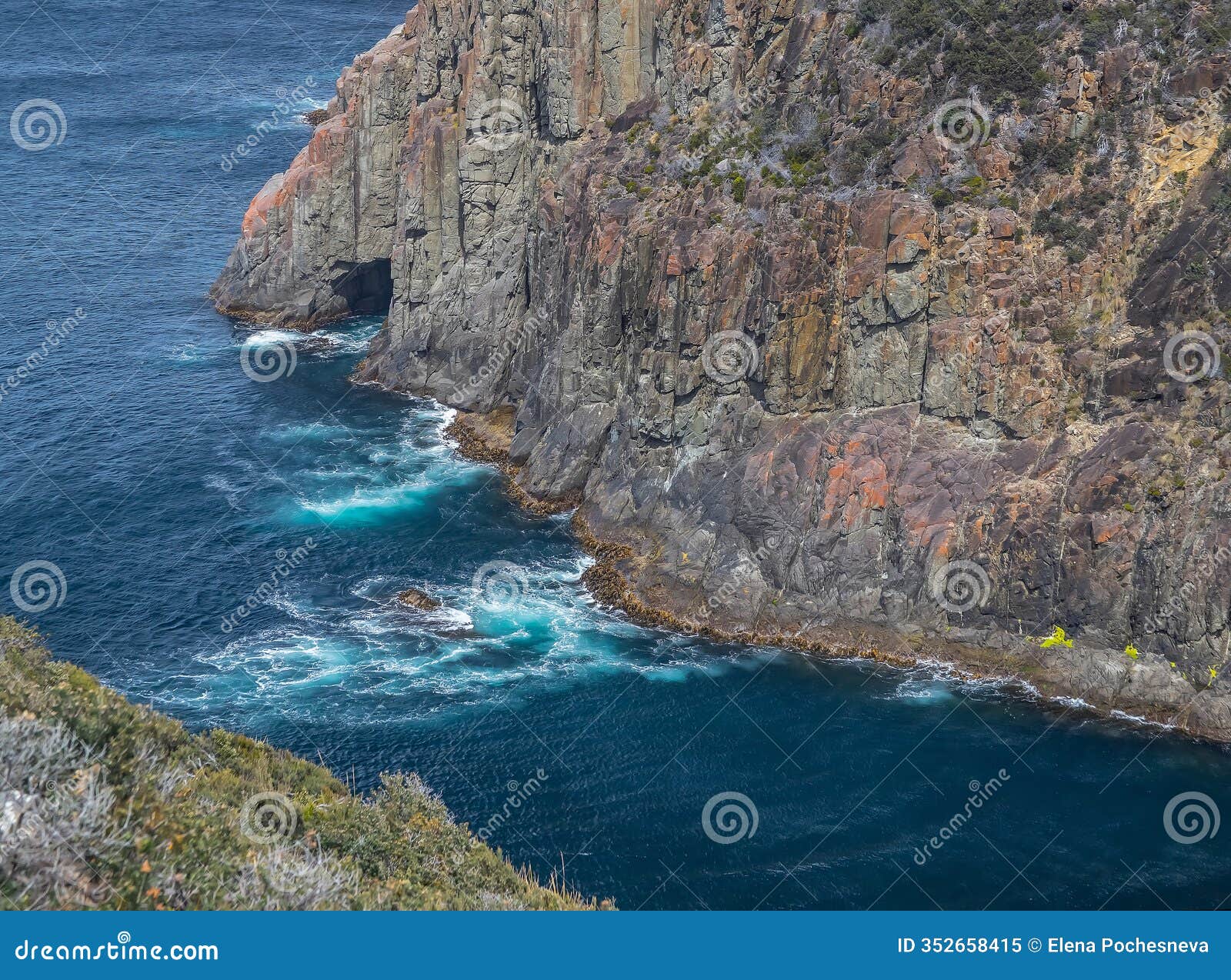 breathtaking view of cape hauy tasmania featuring rugged cliffs lush greenery and the vast ocean. australia