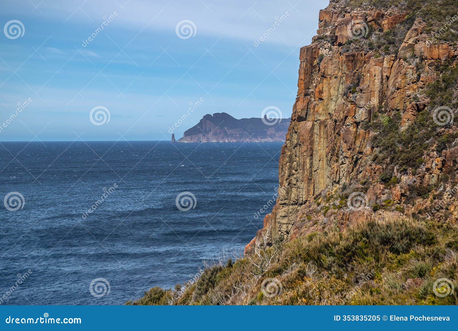 breathtaking view of cape hauy tasmania featuring rugged cliffs lush greenery and the vast ocean. australia