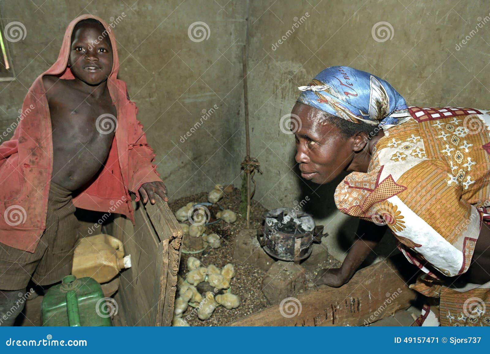 Breeding Chicks By Ugandan Woman With Son Editorial Photo 49157471 