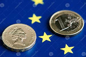 Brexit One British Pound And Euro Coin On European Union Flag Brexit One British Pound And Euro Coin On European Union Flag