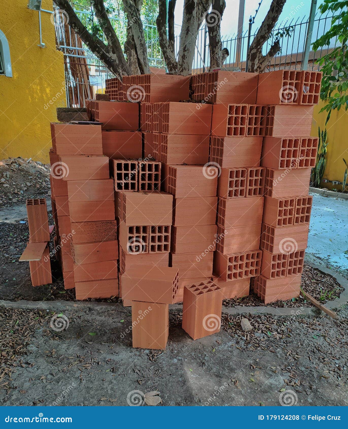 brick blocks piled up over one another in a construction site.