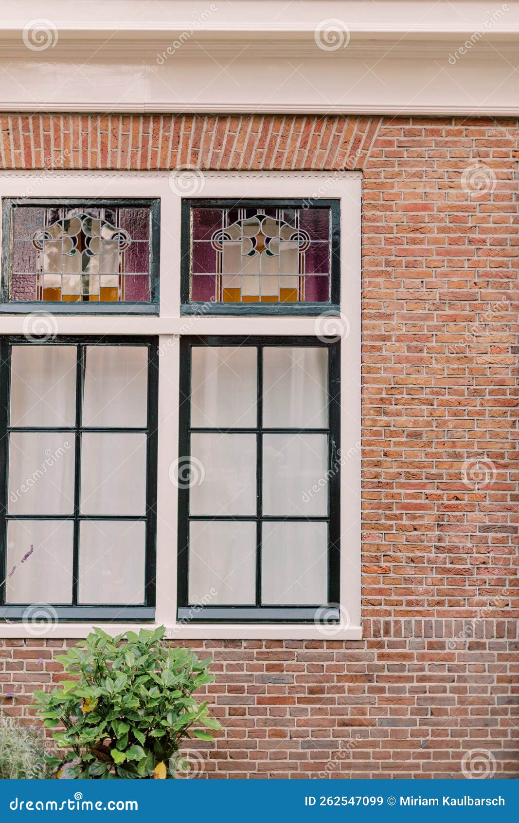 A Brick House Facade with Two Large Windows. Stock Image Image of
