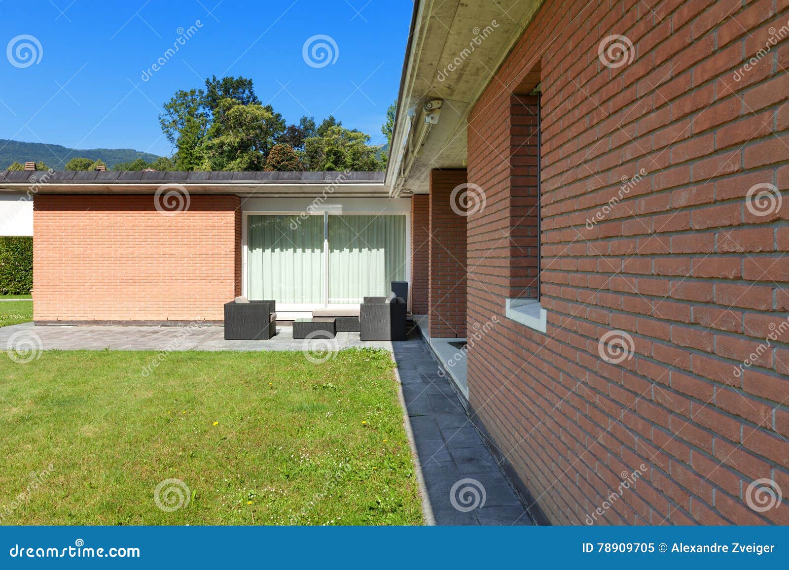 Brick house with garden stock image. Image of construction - 78909705
