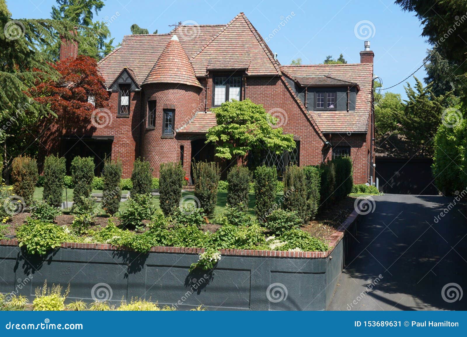 Brick House With Turret In Affluent Neighborhood Stock 