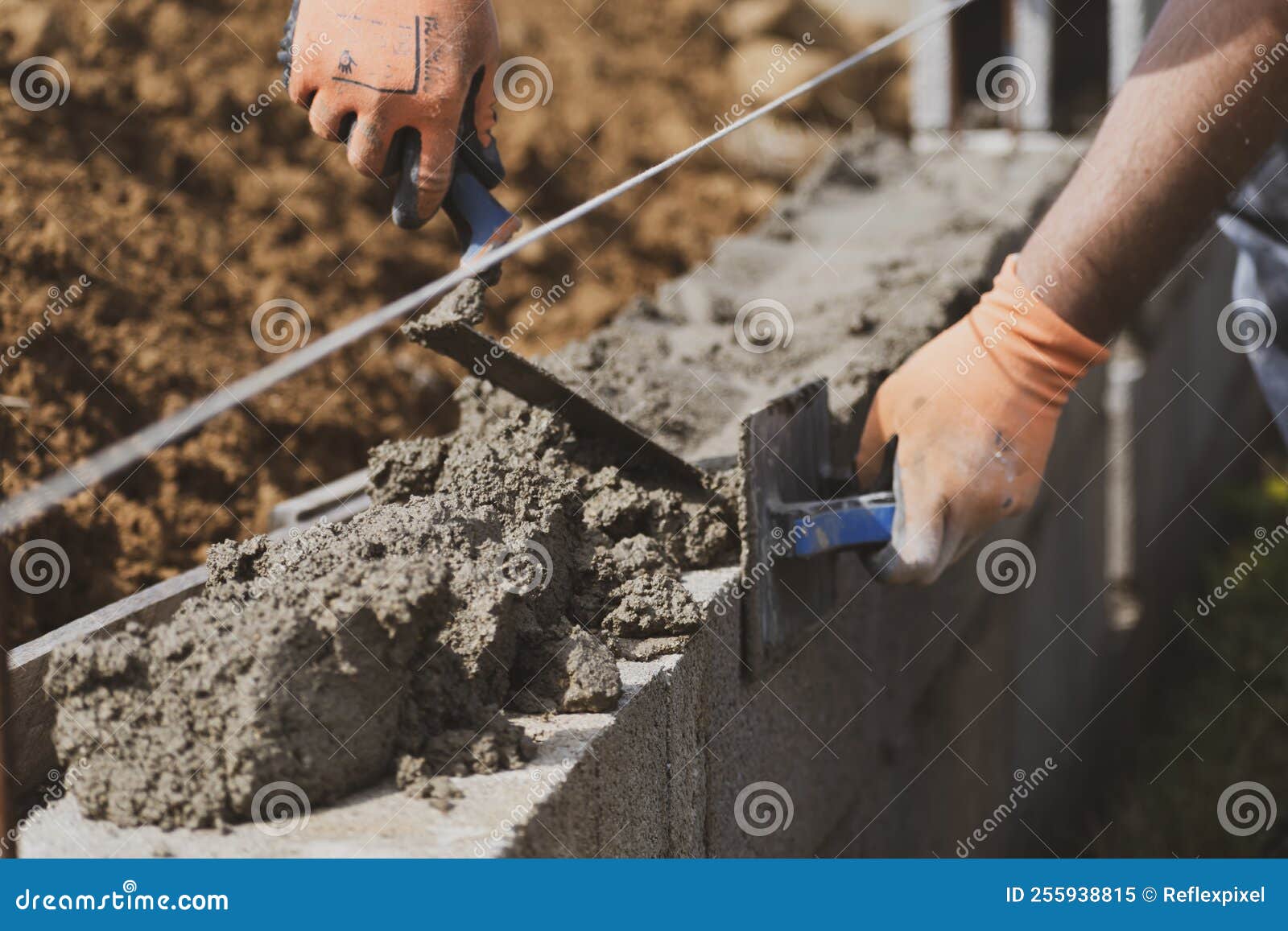 Bricklayer in Glove Spreading Concrete To Build a Wall on Construction Site Stock Image Image