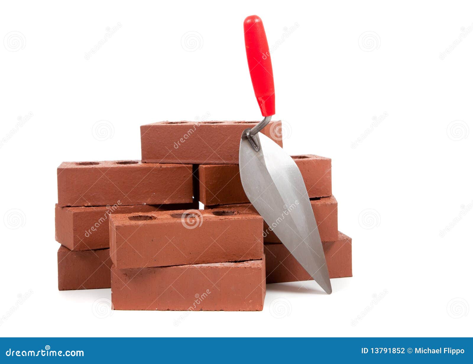 bricks and a trowel on white