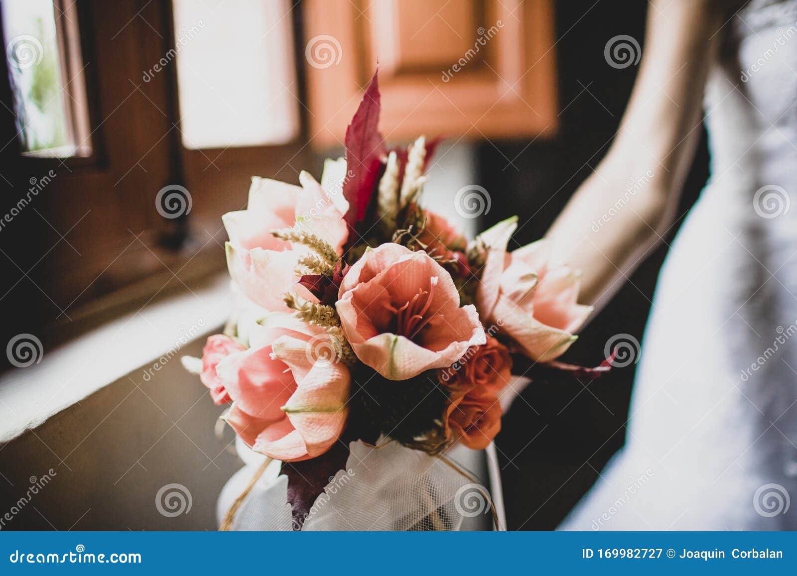 Bridal Bouquet Held by Her with Her Hands at Her Wedding Stock Image